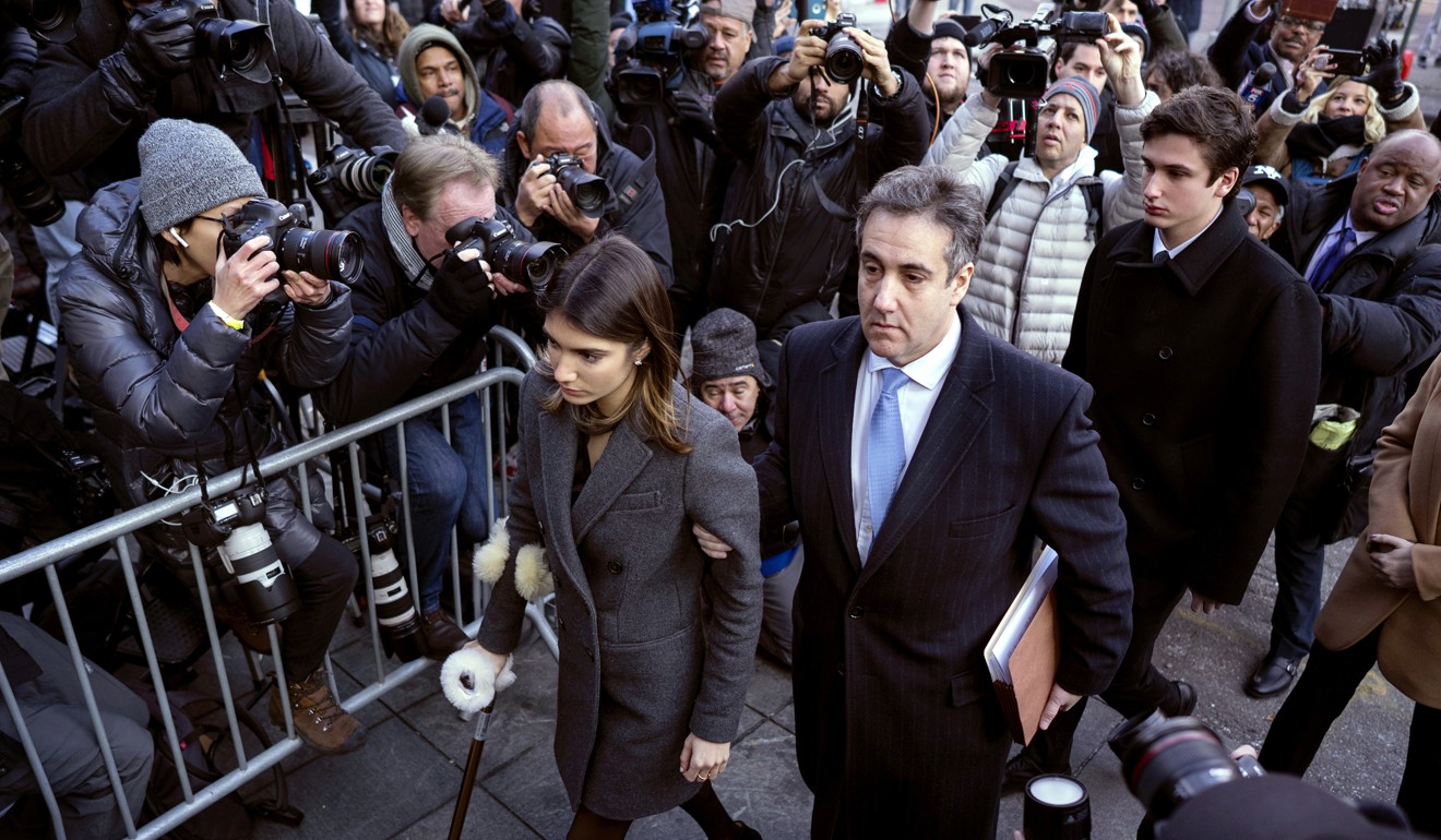 Michael Cohen, centre, President Donald Trump's former lawyer, accompanied by his children Samantha, left, and Jake, right, arrives at federal court for his sentencing on Wednesday in New York. Photo: AP