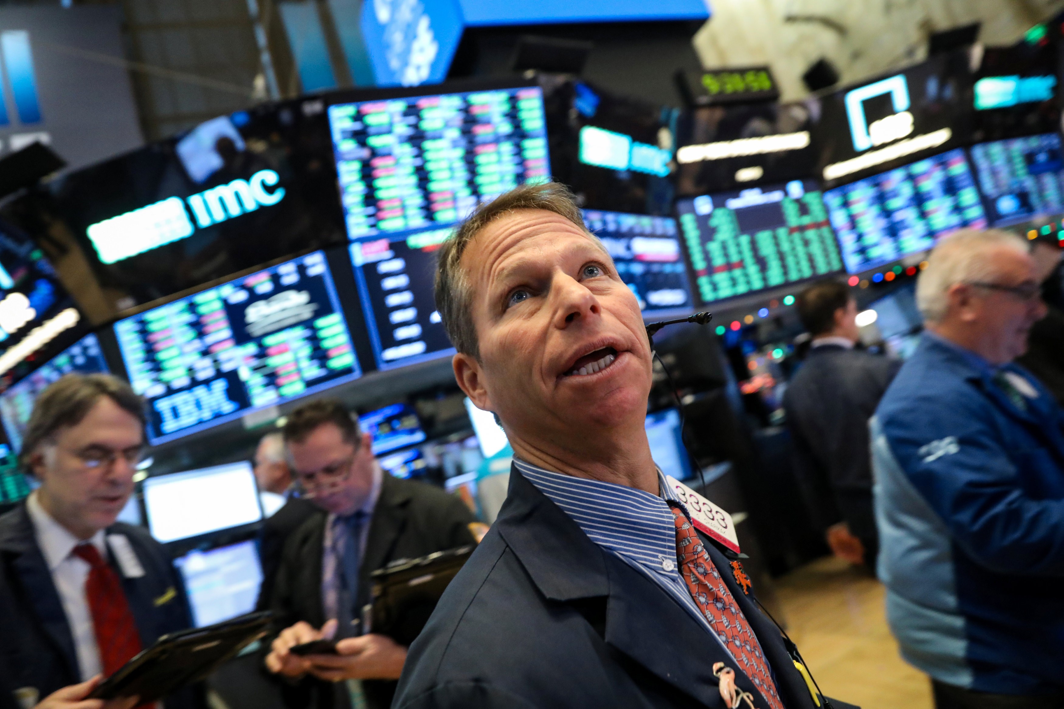 Traders work on the floor of the New York Stock Exchange on December 11. Photo: Reuters