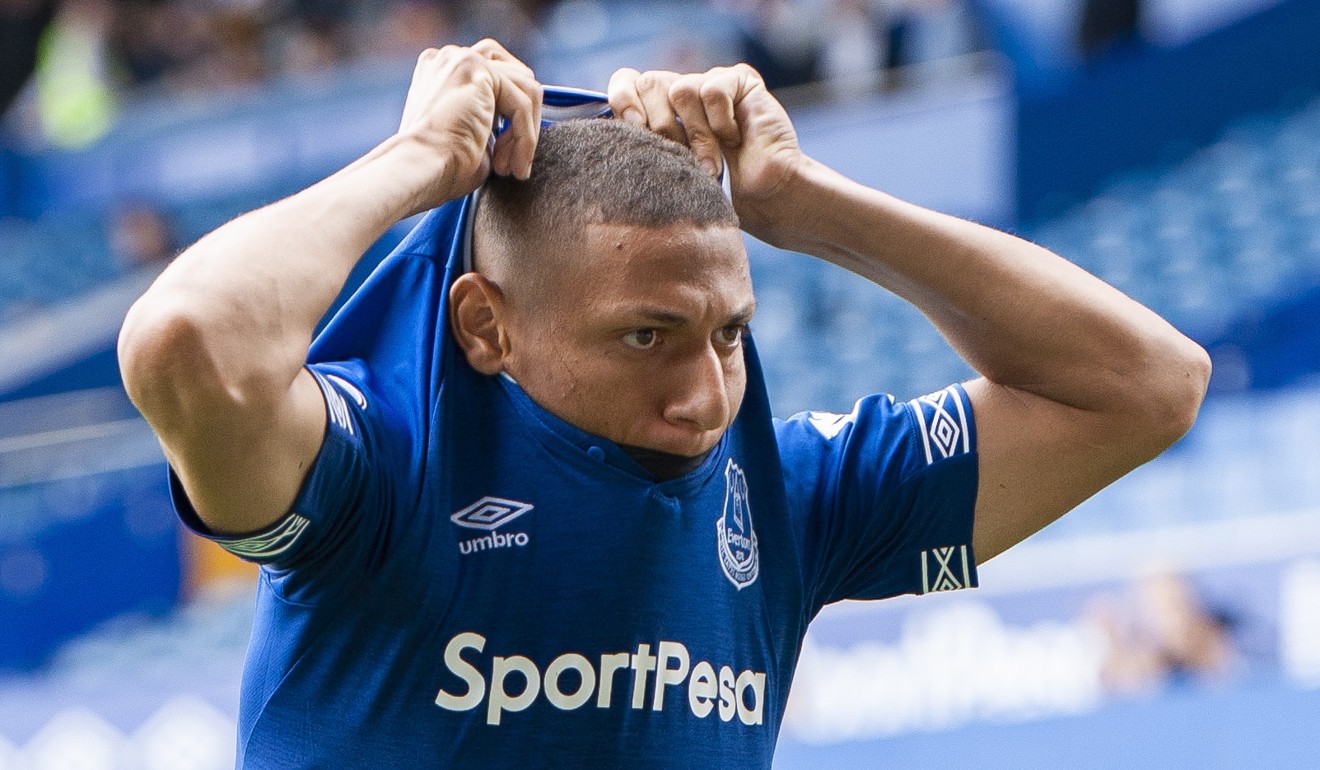 Everton’s Richarlison removes his shirt. Photo: EPA