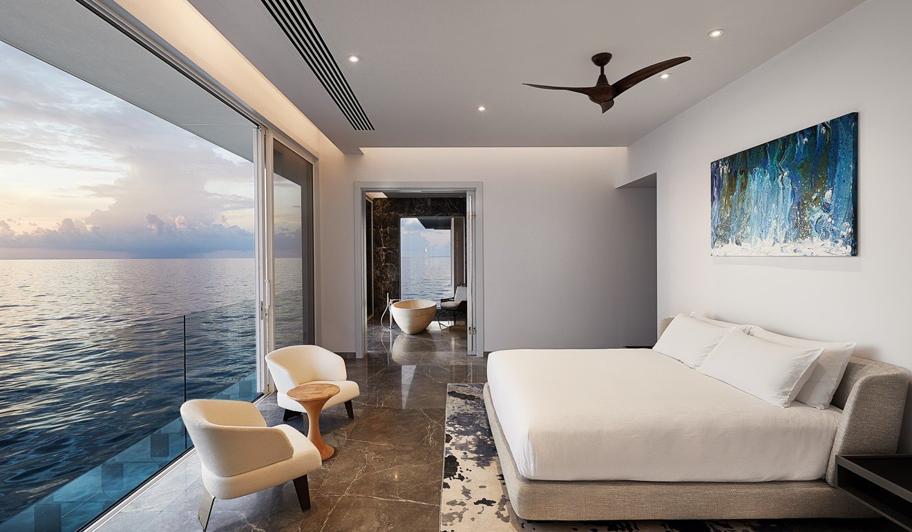 Gaze outside at the water from the comfort of the bed in the master bedroom. Photo: Justin Nicholas