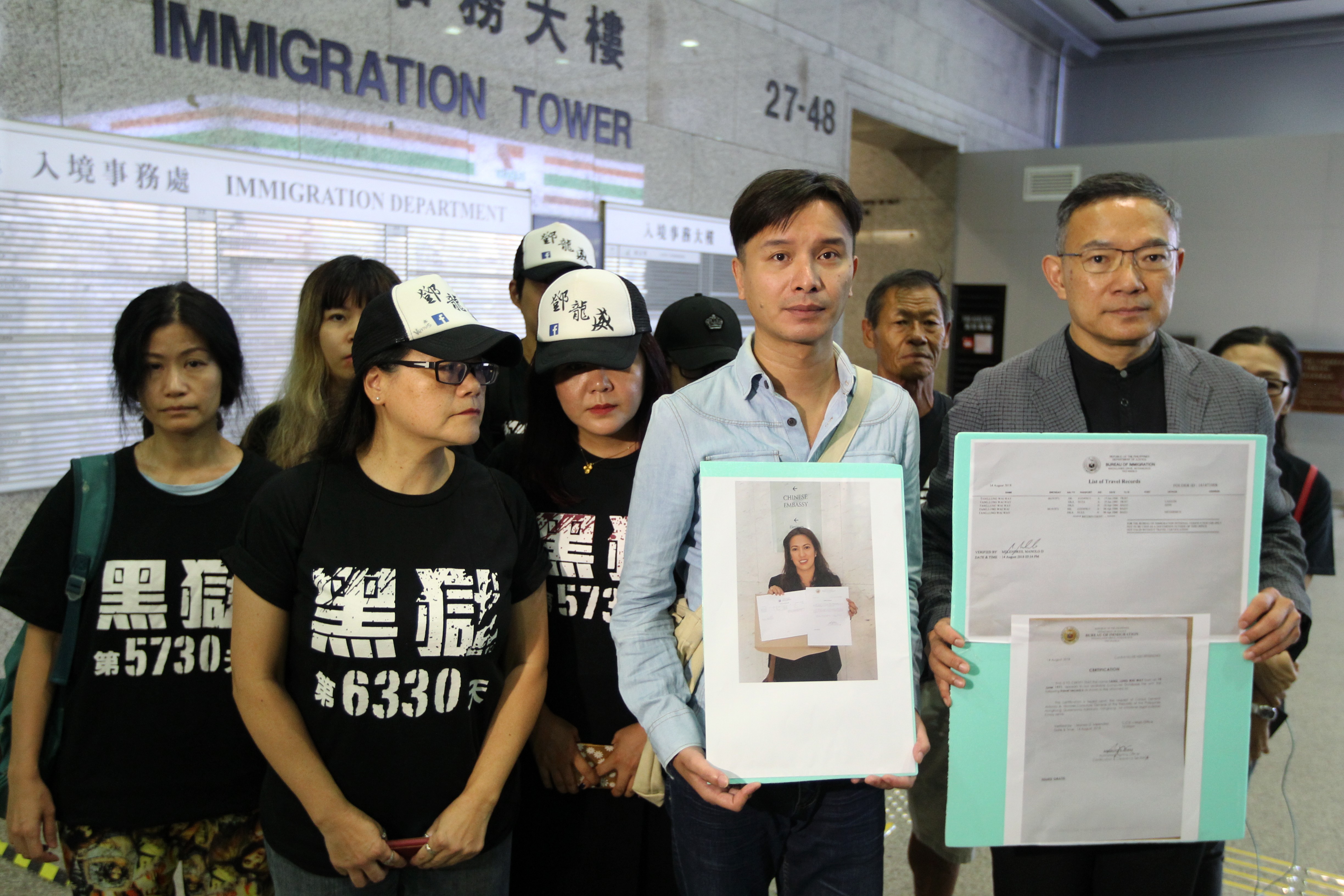 Lawmaker Paul Tse Wai-chun (right) and Billy Tang Lung-piu (centre), brother of jailed Tang Lung-wai, meet the media at Immigration Tower in Wan Chai. Photo: Roy Issa