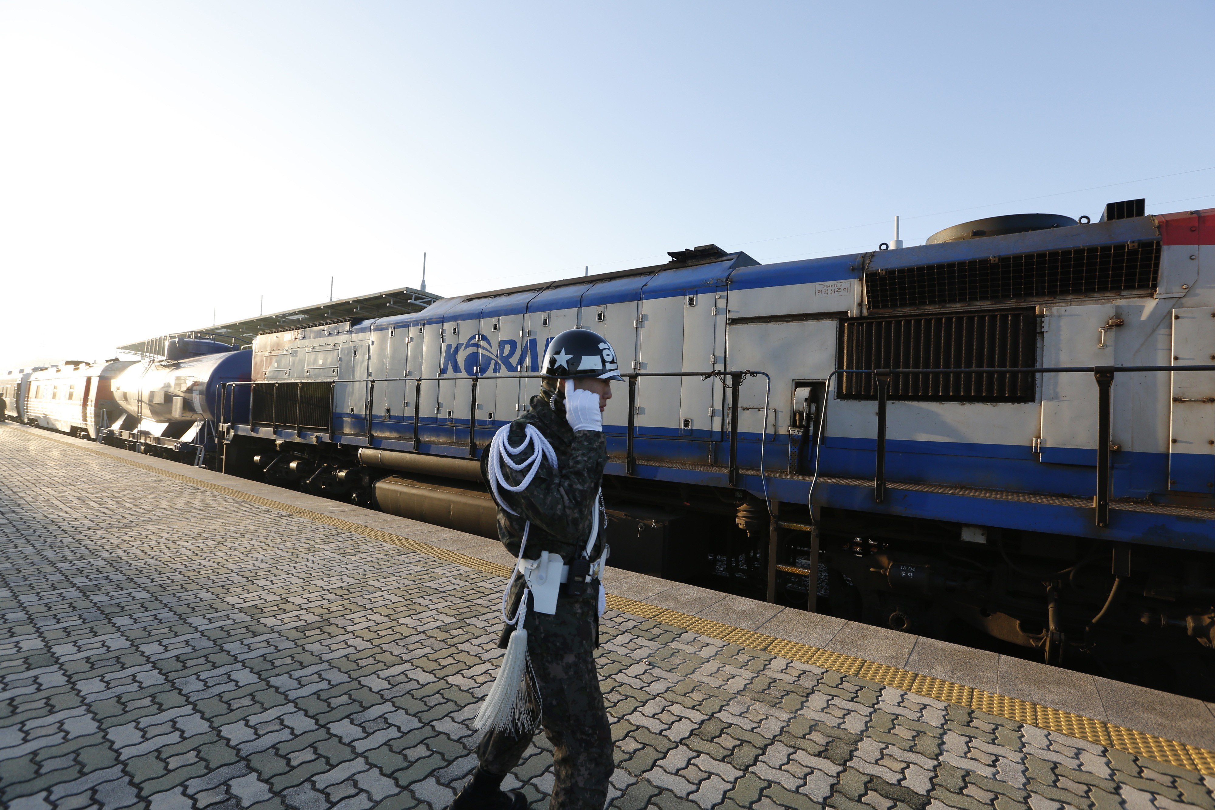 A South Korean army soldier stands next to a train before it crosses the border into North Korea. Photo: AP