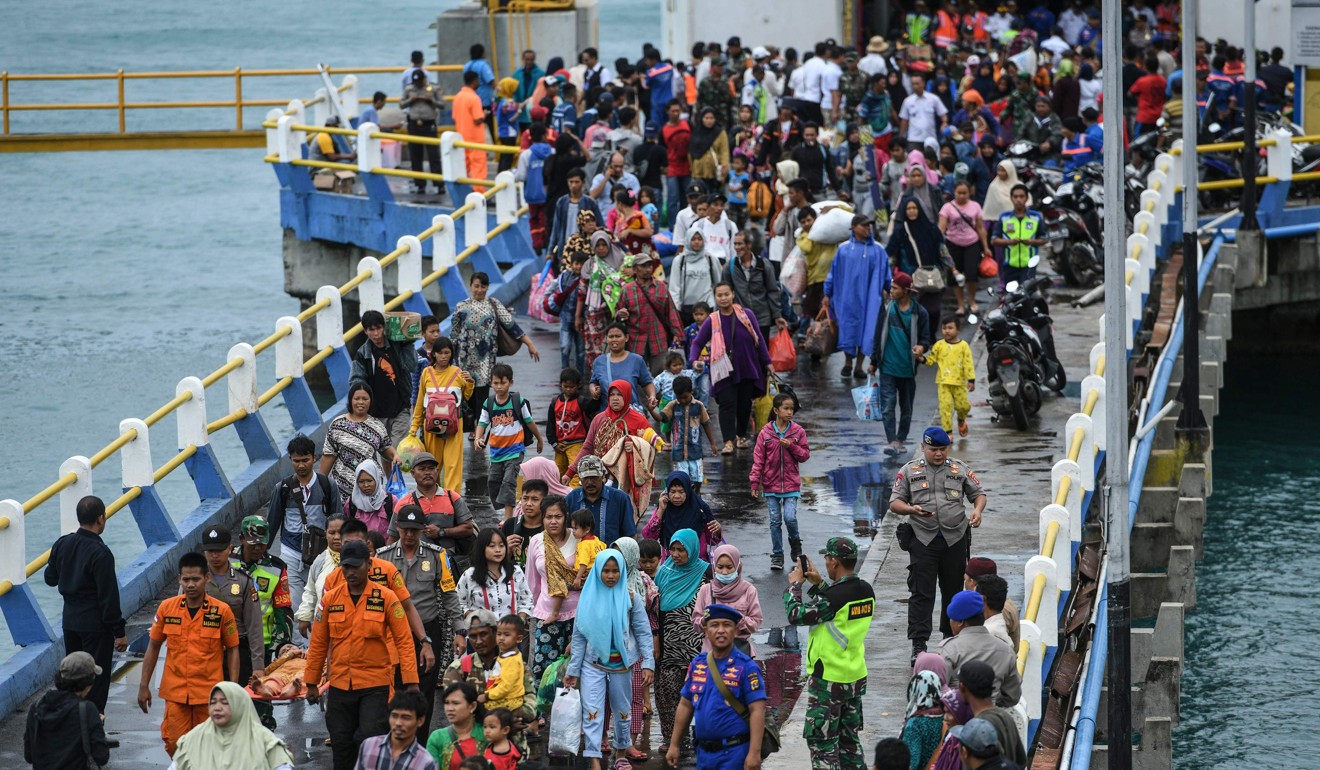 Residents disembark from a ferry at the port after being evacuated from Sebesi Island, in Bakauheni in Lampung province after the December 22 tsunami. Photo: AFP