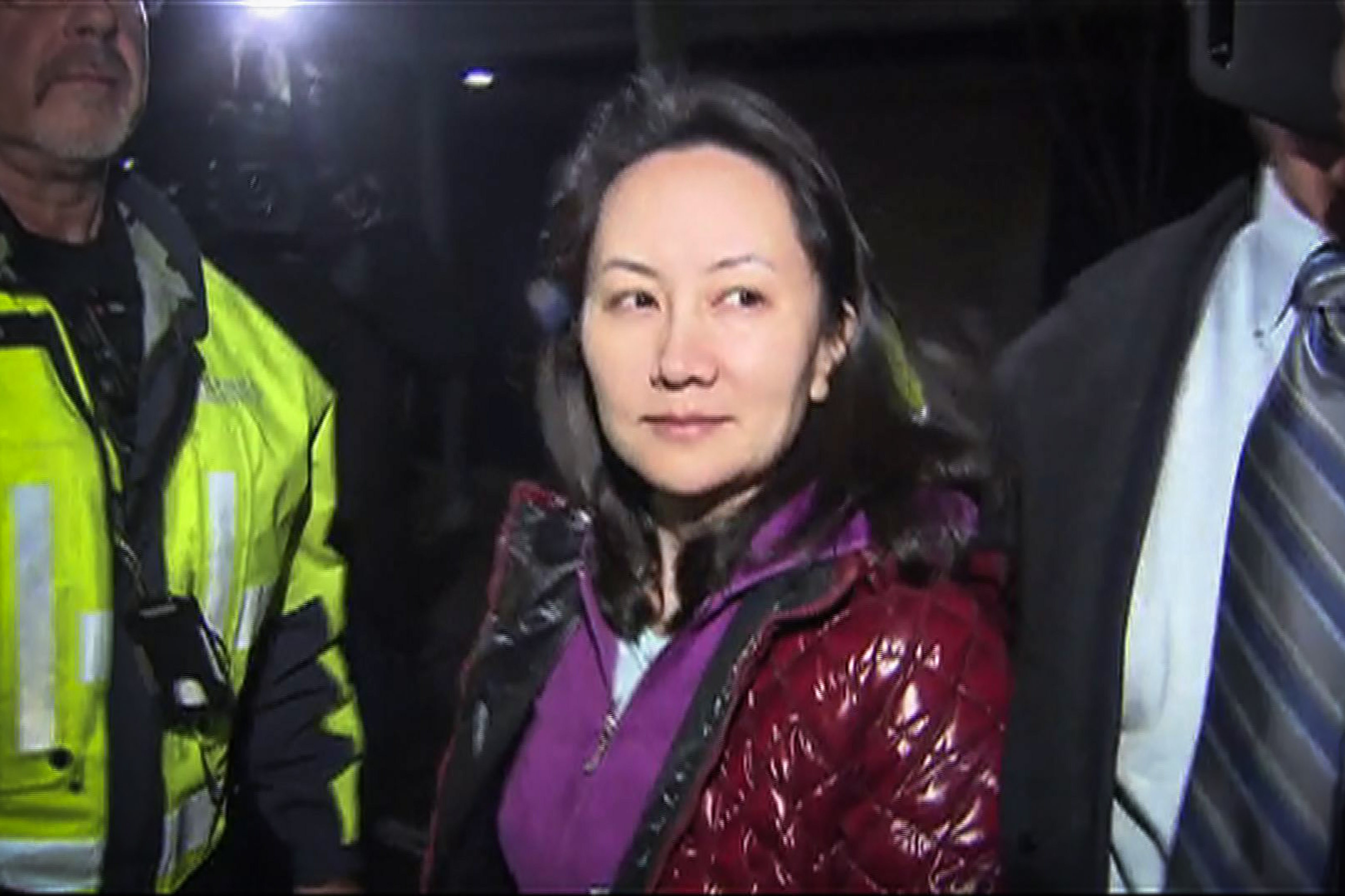 Huawei CFO Meng Wanzhou exits the court registry following her bail hearing at British Columbia Superior Court in Vancouver on December 11. Huawei, founded in 1987 by a former officer of the Chinese People's Liberation Army, has come under increased scrutiny of late for its relations with the Beijing government. Photo: CTV Television Network/AFP