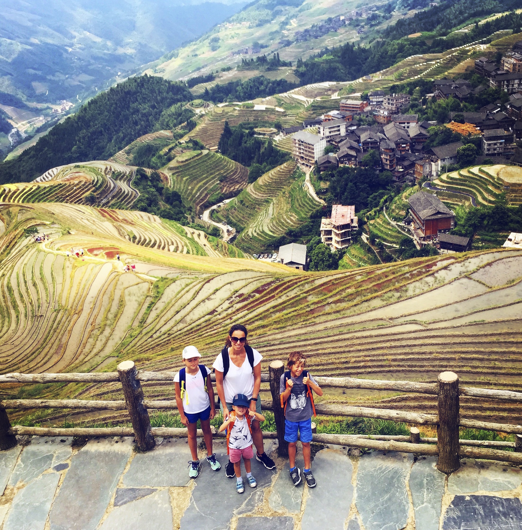 Cecile Pont and her children in Rice fields in Guilin, China.