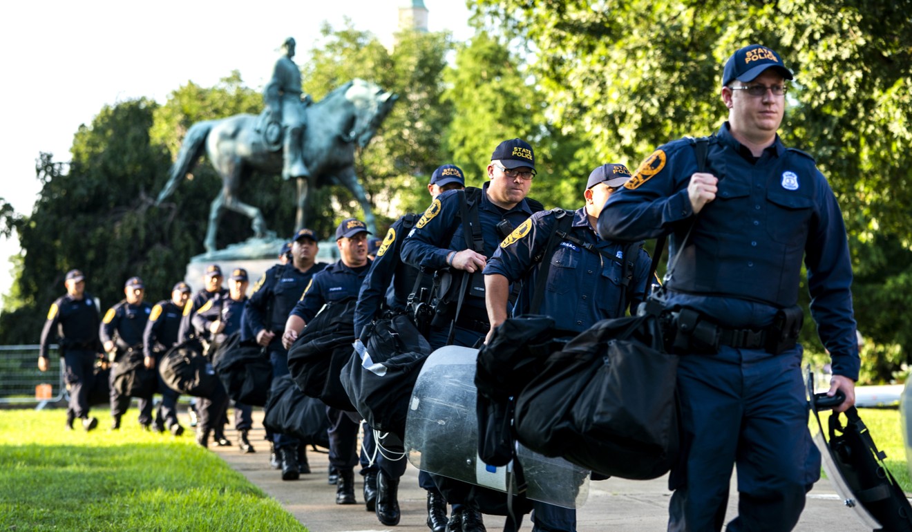 Police officers prepare for a protest in downtown Charlottesville, Virginia on August 10, 2018. Photo: EPA