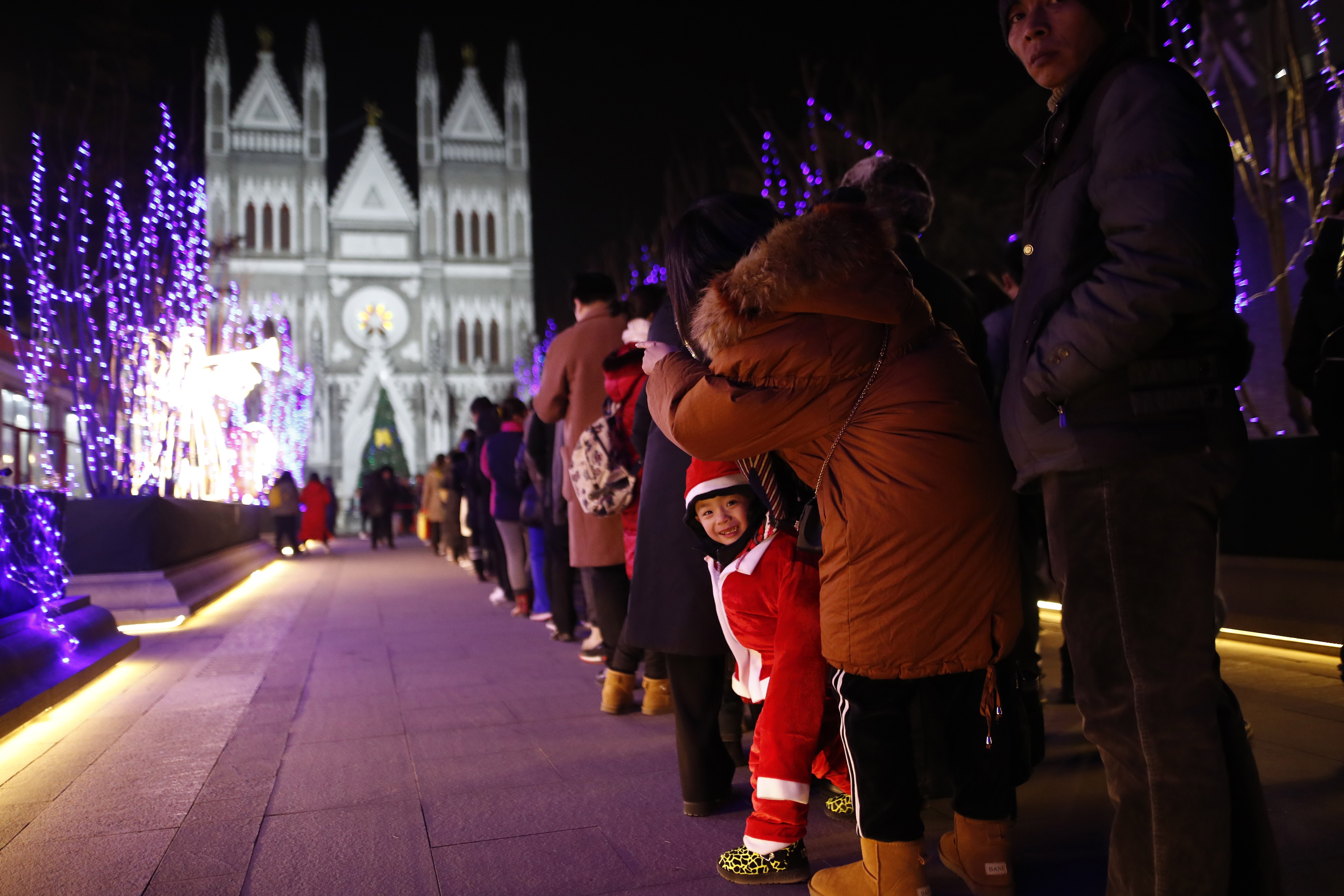 Catholics wait to attend Christmas Eve mass at the Xishiku Catholic Church in Beijing last month. Will 2019 be the year Pope Francis finally visits China? Photo: EPA-EFE