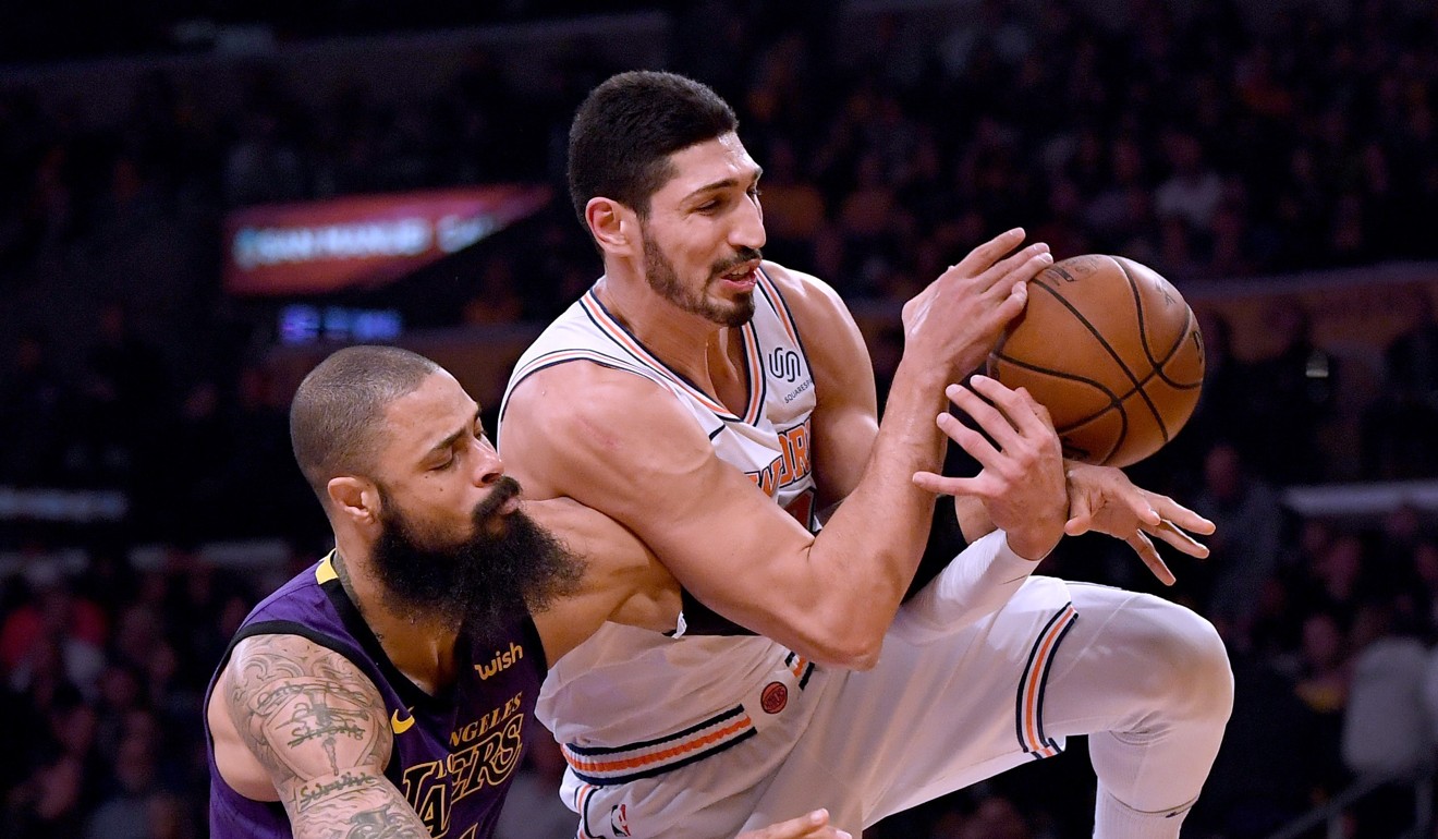 Enes Kanter and Tyson Chandler go for a rebound during the first quarter. Photo: AFP