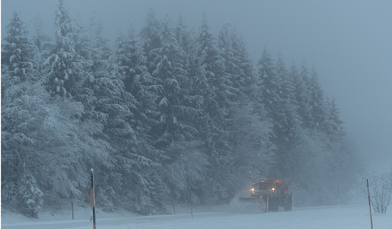 A snow plough clearing a road on Schauinsland mountain near Hofsgrund, southern Germany. Photo: AFP