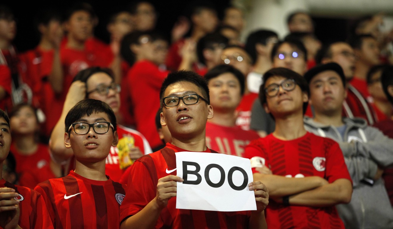 A Hong Kong fan silently protests the national anthem during a World Cup qualifier at Mong Kok Stadium in November 17. Photo: AFP
