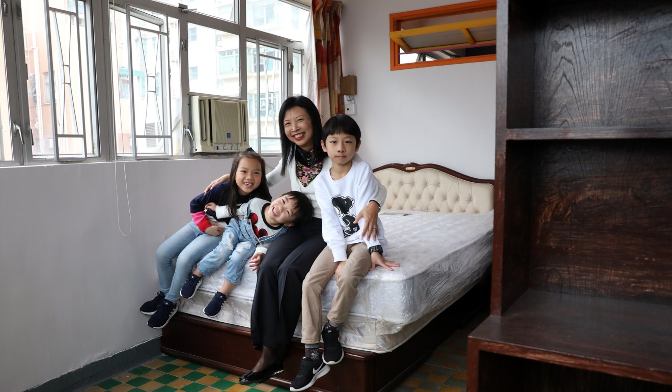 Landlady Cindy Wong with children of tenants in her flat. Photo: Nora Tam