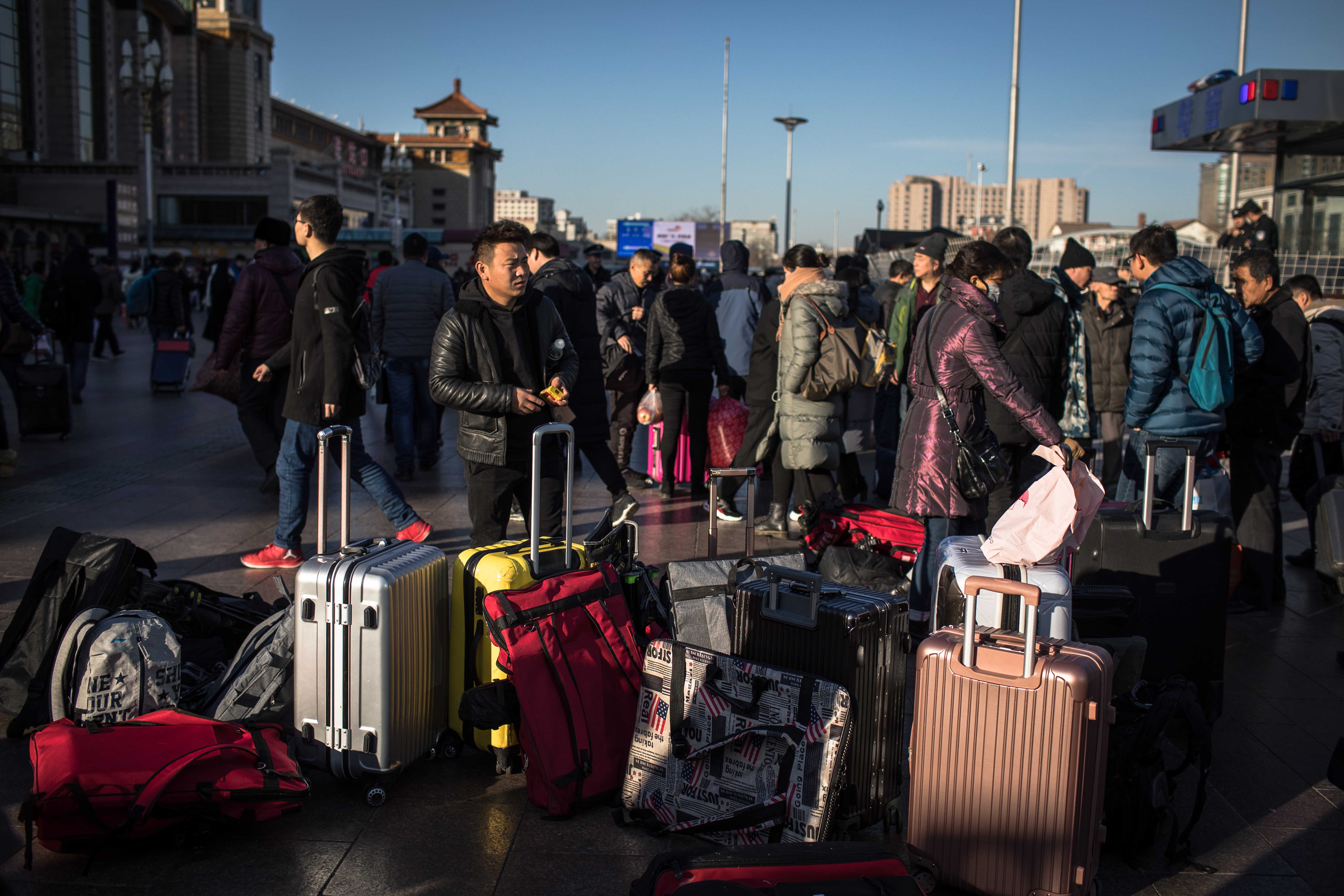 Passengers at Beijing railway station get ready for the journey ahead on Monday. Photo: EPA