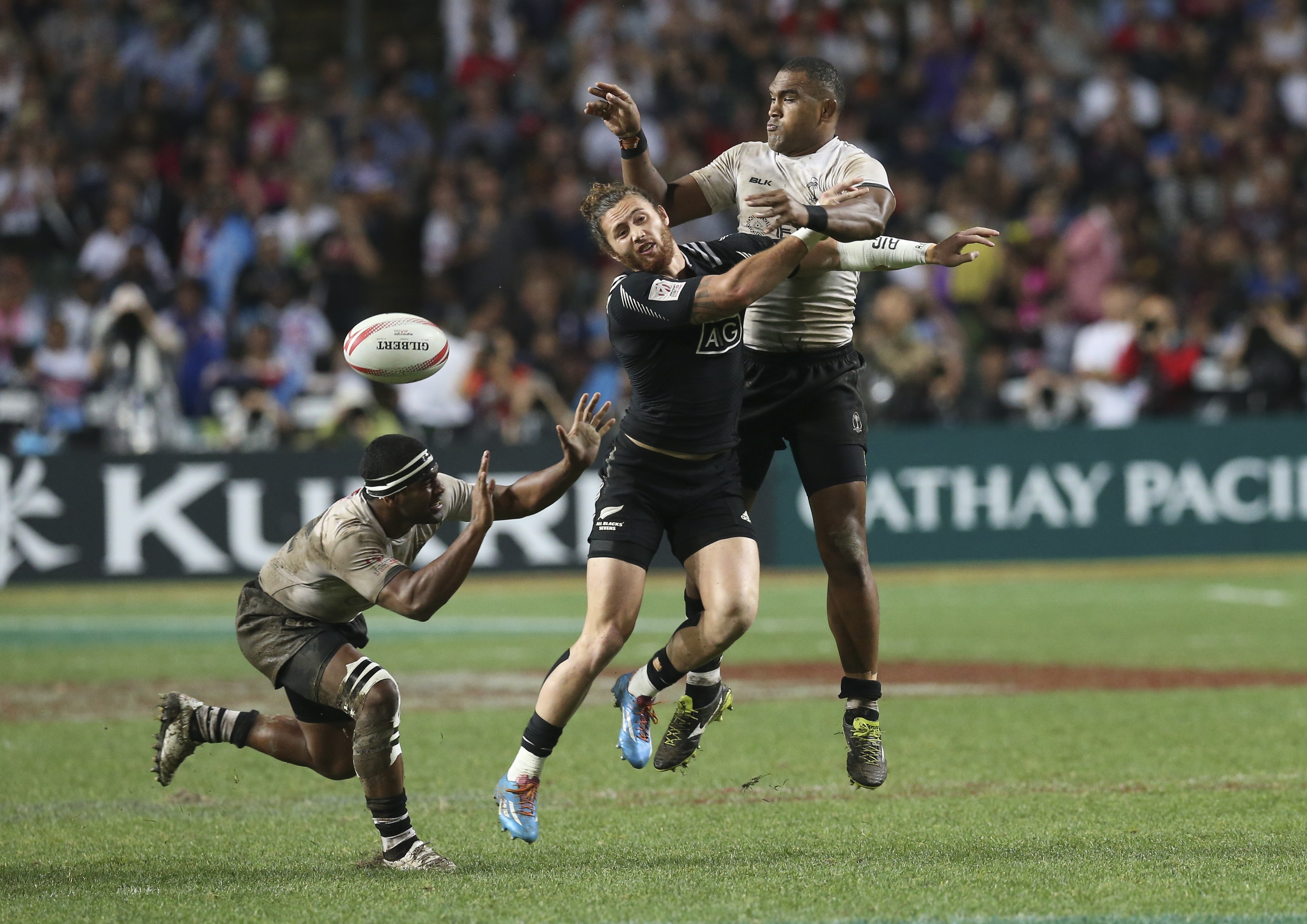 Isake Katonibau (right) makes his presence felt against New Zealand in the final of the 2016 Cathay Pacific/HSBC Hong Kong Sevens. Fiji won 21-7, their fourth victory in a row. Photo: K. Y. Cheng