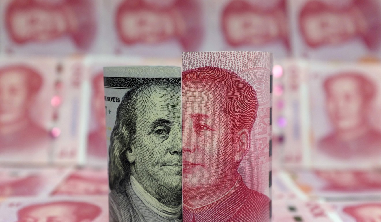A Benjamin Franklin US$100 banknote and a Chinese 100 yuan banknote depicting late Chinese chairman Mao Zedong are seen in a picture illustration. Photo: Reuters