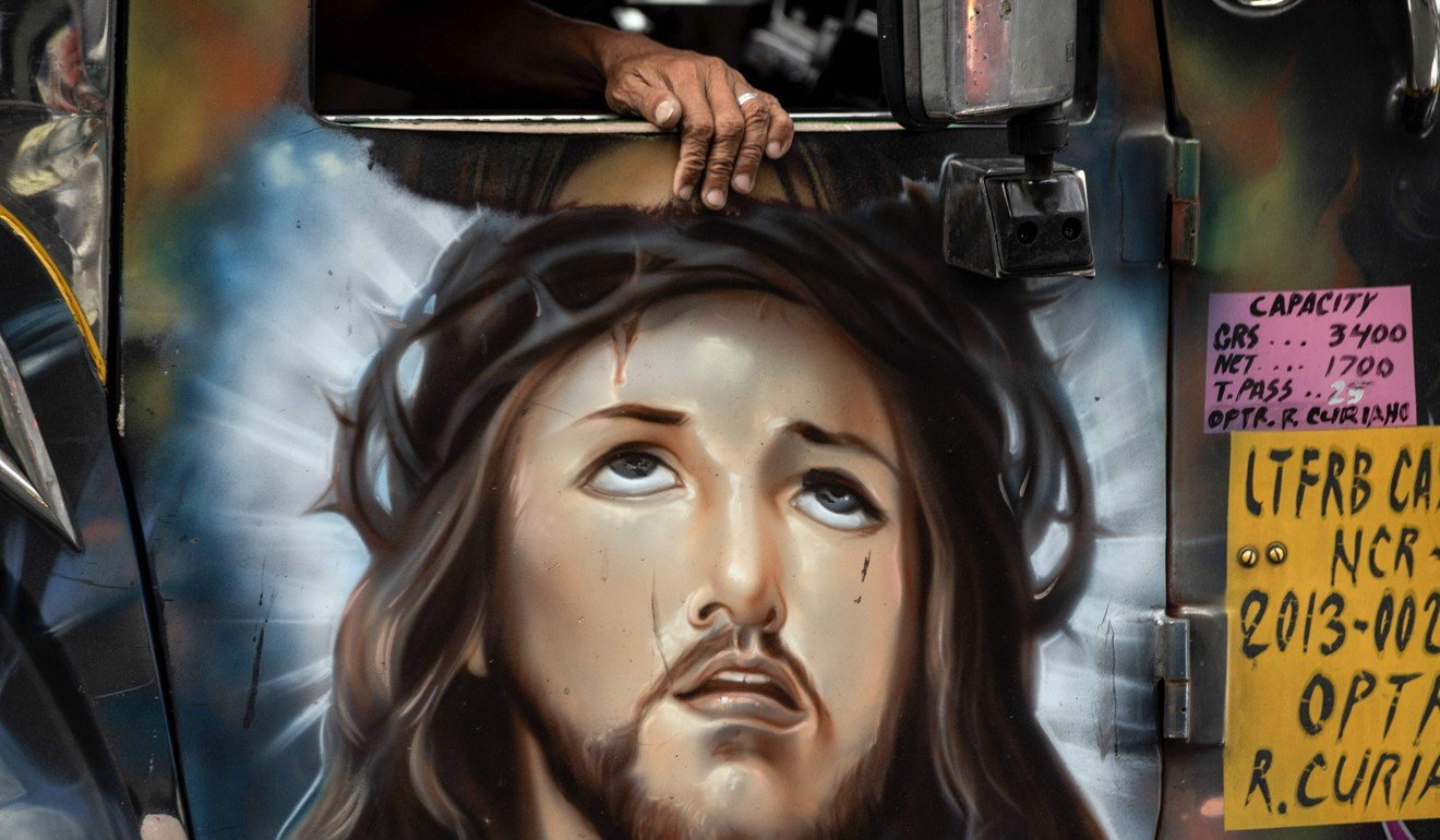 A depiction of Jesus Christ painted on the door of a jeepney in Manila. Photo: Agence France-Presse