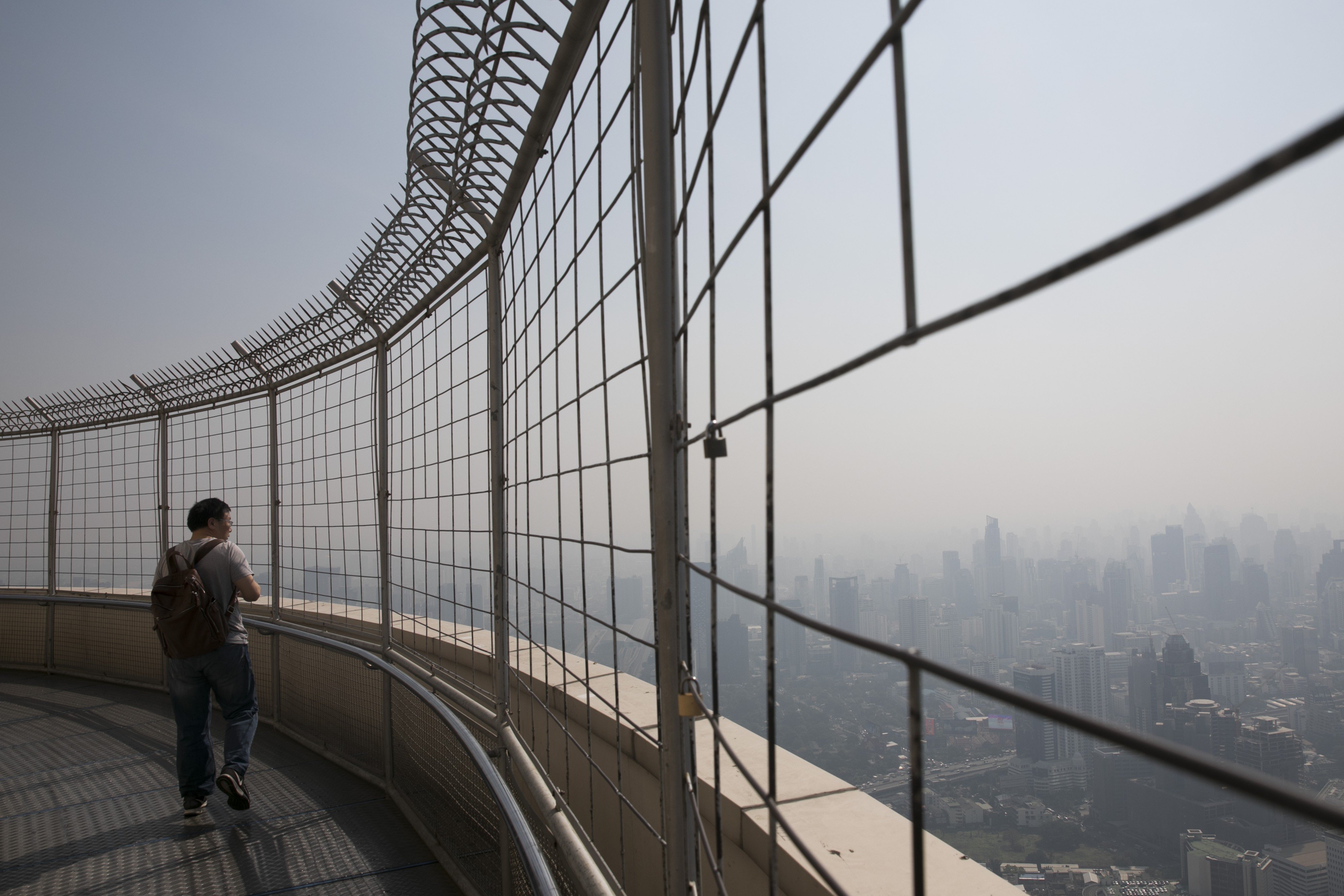 A tourist on the observation deck at Baiyoke Tower in Bangkok. Photo: Bloomberg