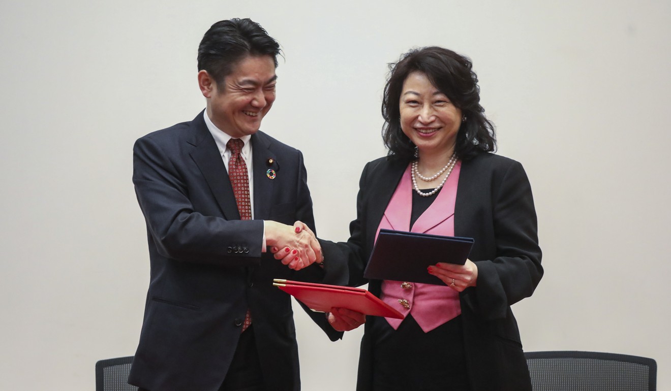 (L-R): Minister of Justice of Japan, Takashi Yamashita and Secretary for Justice, Teresa Cheng Yeuk-wah, sign a Memorandum of Cooperation during a ceremony at Justice Place in Central. The memorandum is part of efforts by the Inclusive Dispute Avoidance and Resolution Office under Cheng's department, which aims to promote Hong Kong as a hub for deal making and international legal and dispute resolution services. 09JAN19 SCMP / K. Y. Cheng