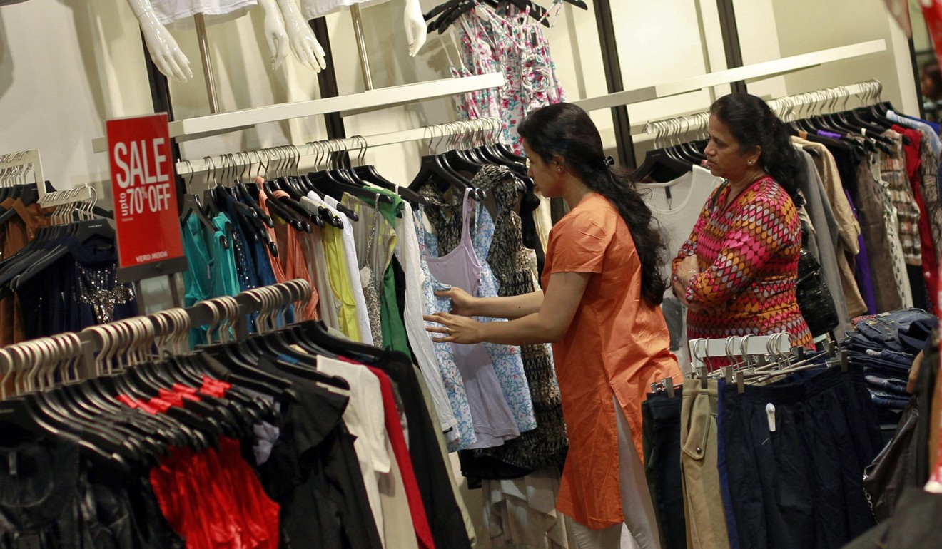 Shoppers check out a sale at a mall in Mumbai. Photo: Reuters