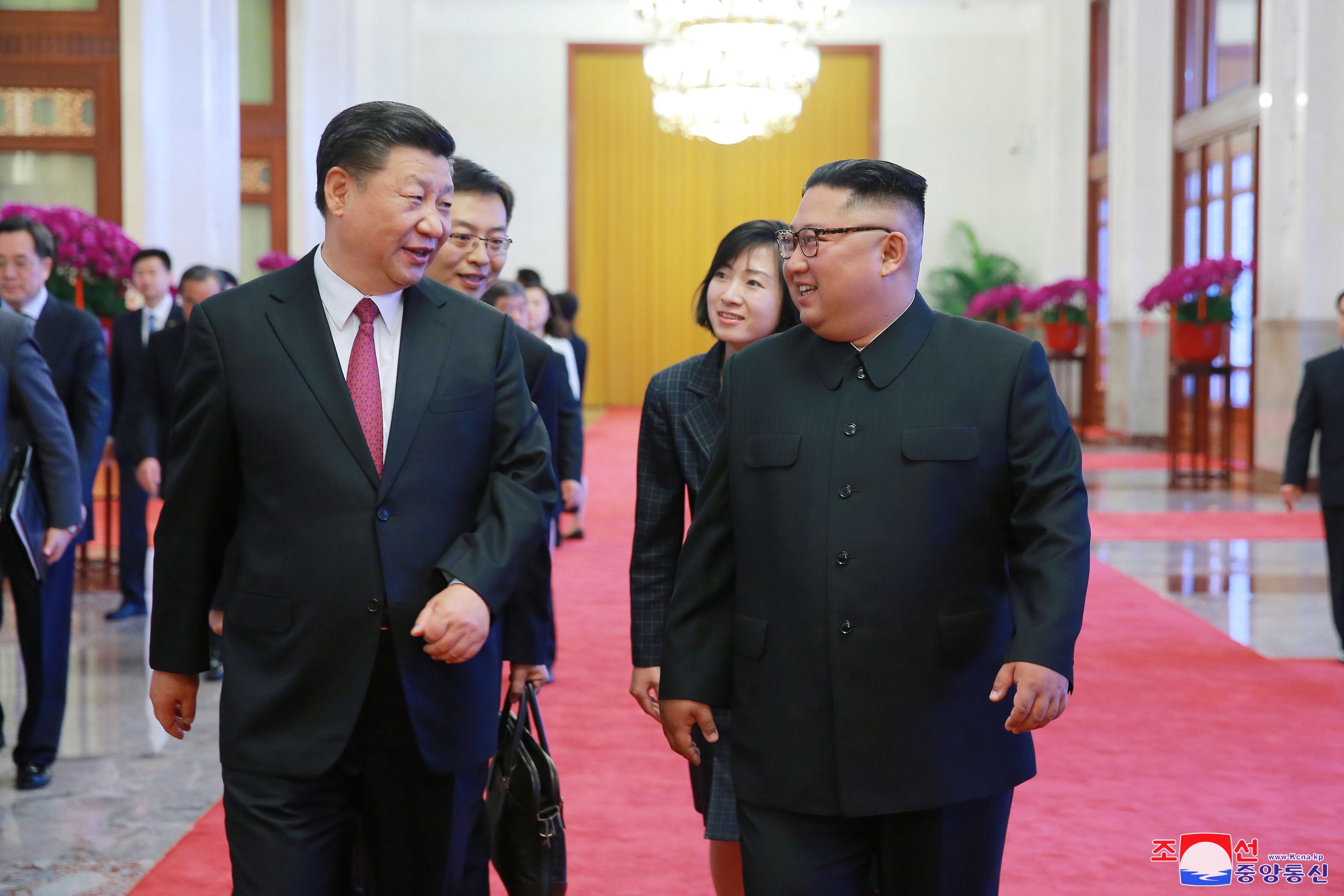 Chinese President Xi Jinping and North Korean leader Kim Jong-un chat during a meeting in Beijing in June 2018. Photo: EPA-EFE