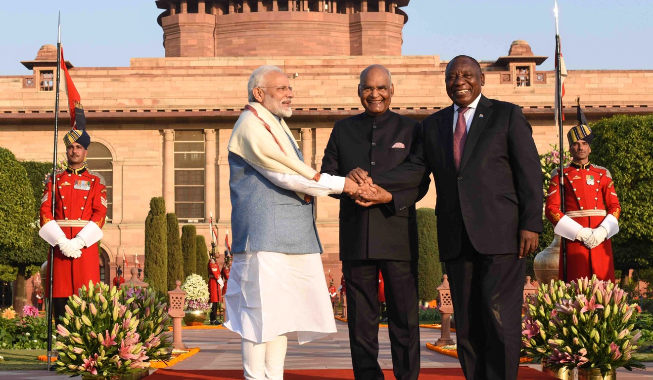 Indian President Ram Nath Kovind (C) shakes hands with South African President Cyril Ramaphosa (R) and Indian Prime Minister Narendra Modi (L) during the Republic Day ‘At Home’ reception held by the Indian President at Rashtrapati Bhavan in New Delhi on January 26, 2019. Photo: Handout / RB Photo / AFP