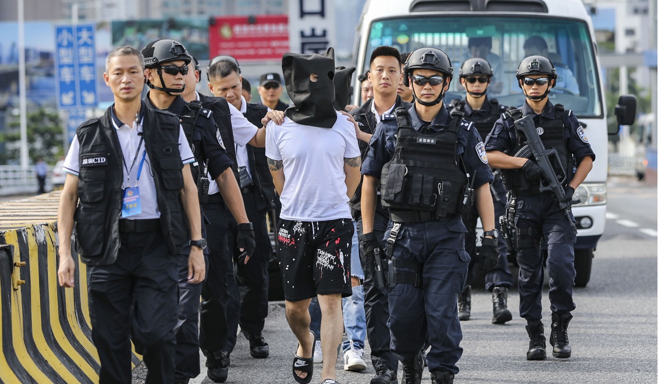 Mainland police hand over three suspects wanted for robbery in Hong Kong in 2018. Photo: Edward Wong