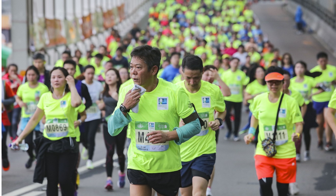 Runners make their way through the Island Eastern Corridor during the 10km run. Photo: Felix Wong