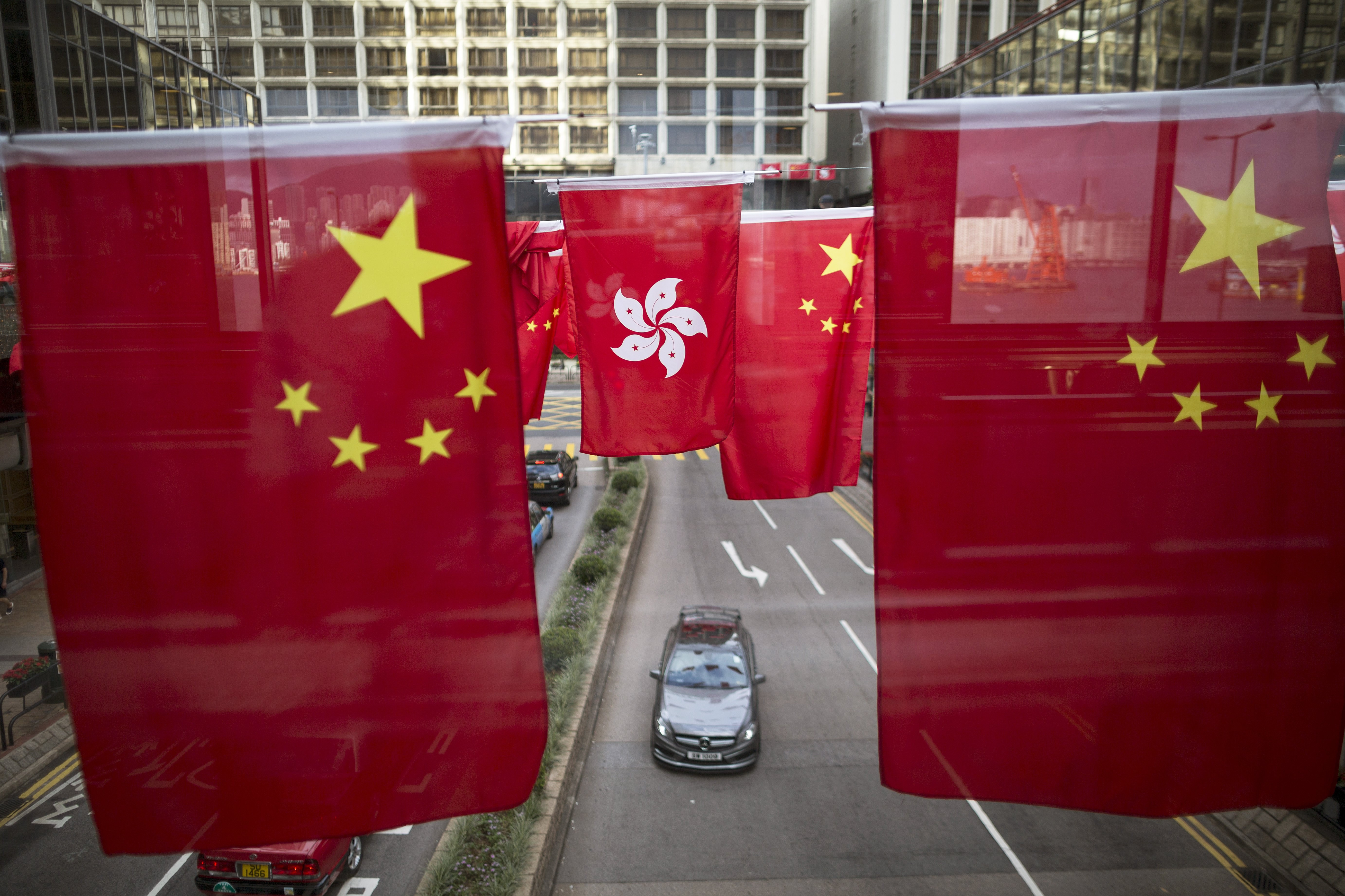 Hong Kong occupies a special role as part of China yet standing outside it, and the escalating rivalry between Washington and Beijing calls for a strengthening of its distinct institutions, including finance. Photo: EPA