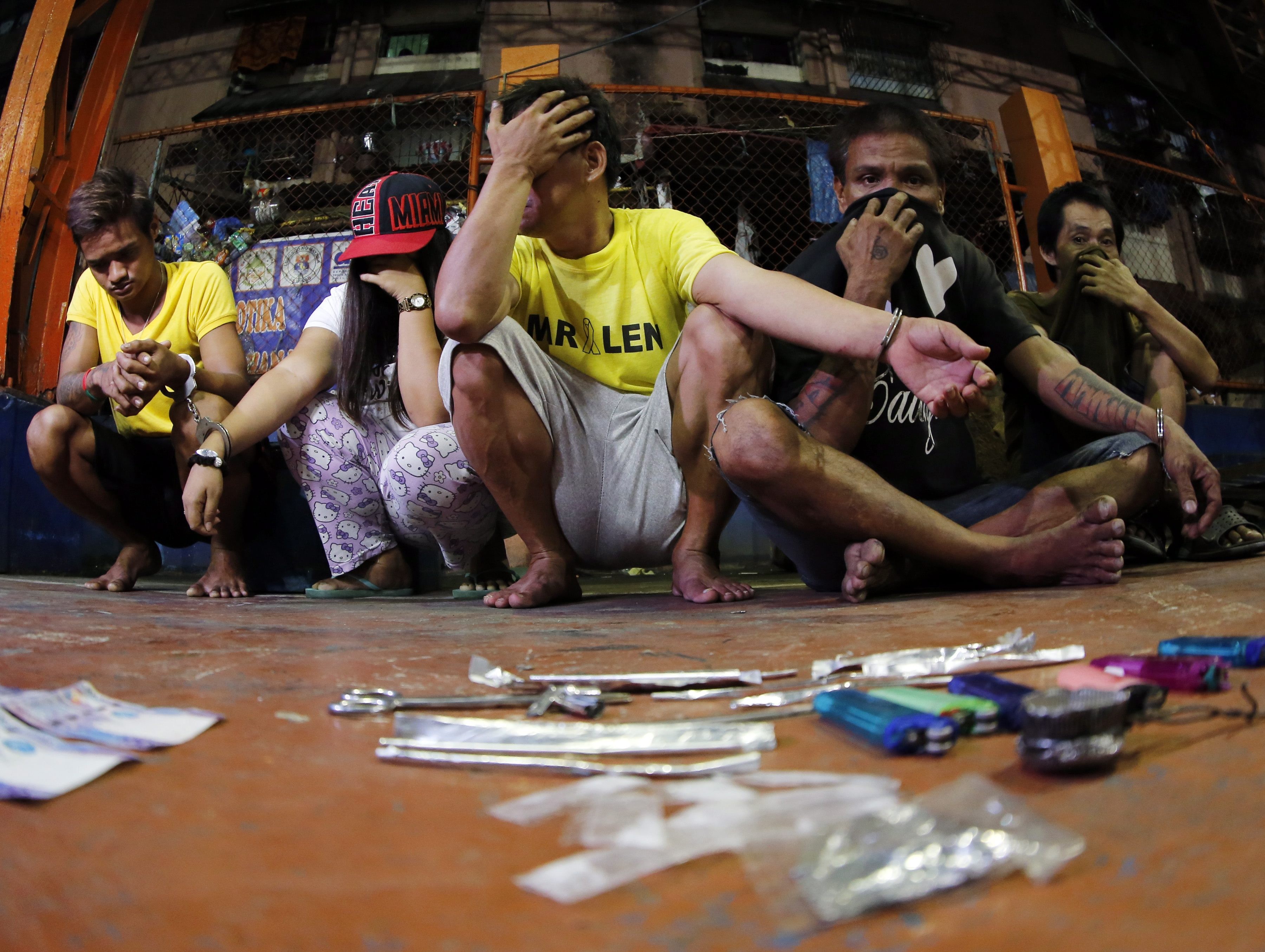 Filipinos arrested during a drug-buying operation wait to be brought to a police station for verification at a slum area in Manila in September 2016. According to the Philippine government, President Rodrigo Duterte’s war on drugs had resulted in more than 5,000 deaths at the end of 2018, though opposition politicians and human rights groups place the toll as high as 20,000. Photo: EPA
