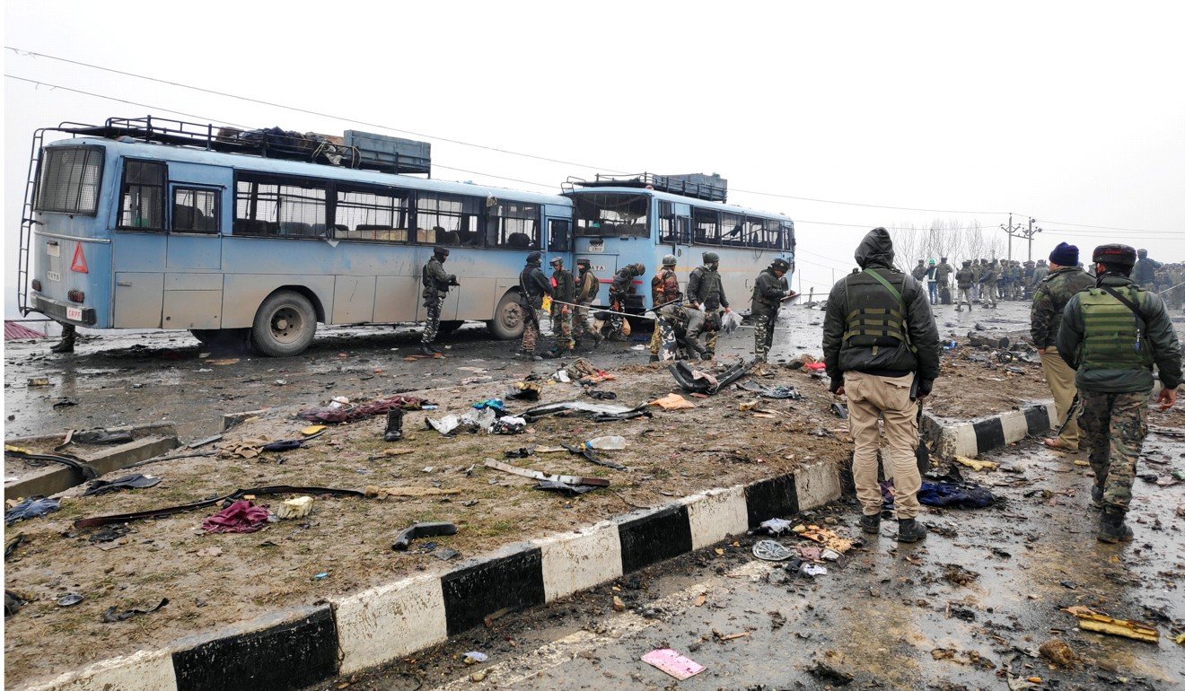 Indian soldiers examine the aftermath of the explosion in Pulwama. Photo: Reuters