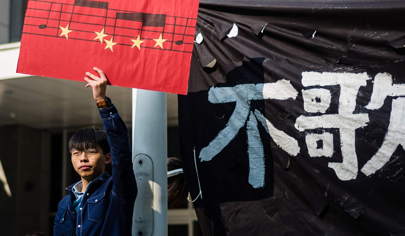 Hong Kong democracy activist Joshua Wong seen at a protest on January 23 against a bill being tabled in the legislature to outlaw abuse of China’s national anthem. Photo: AFP