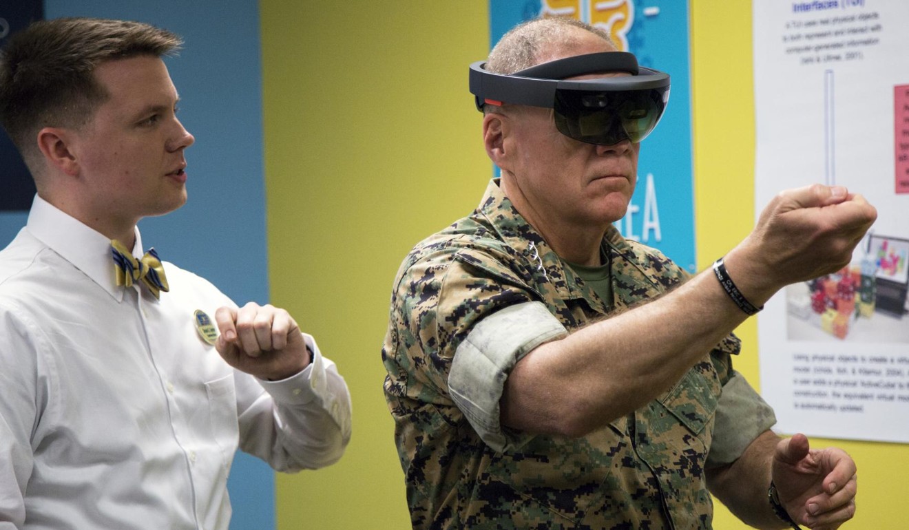General Robert Neller, commandant of the Marine Corps, uses a HoloLens to manipulate virtual objects. Photo: Alamy Stock Photo