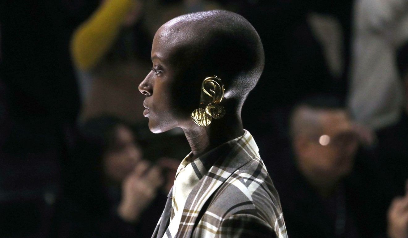 A model presents a look from Gucci women's autumn/winter 2019 collection. Gold ear cuffs that looked like prosthetics were among styling tricks that provided plenty of Instagram fodder for fans of the label. Photo: Matteo Bazzi/Ansa/AP