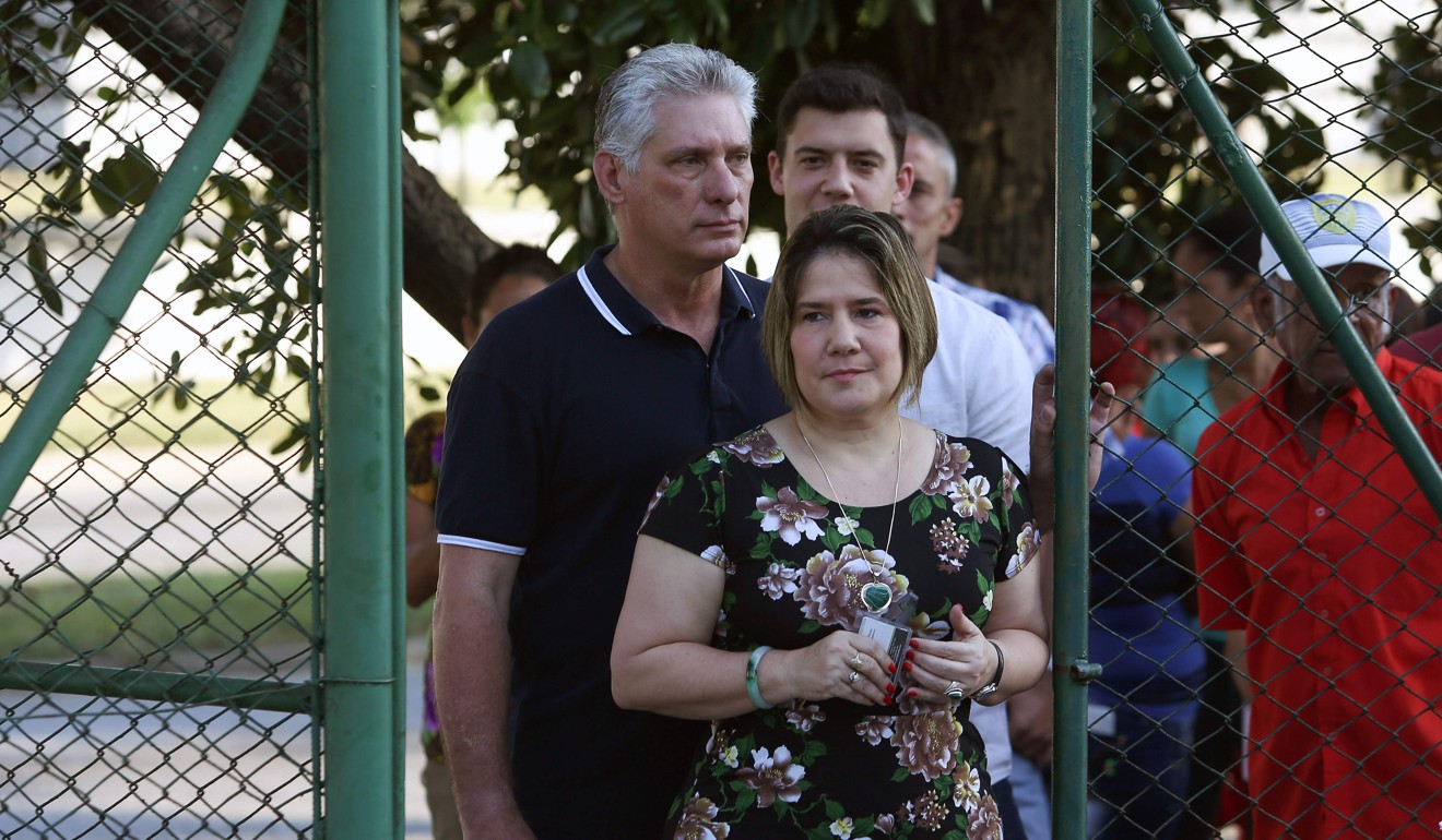 Cuba’s President Miguel Diaz-Canel and his wife Lis Cuesta arrive at a polling station to cast their votes for a constitutional referendum in Havana. Photo: AFP