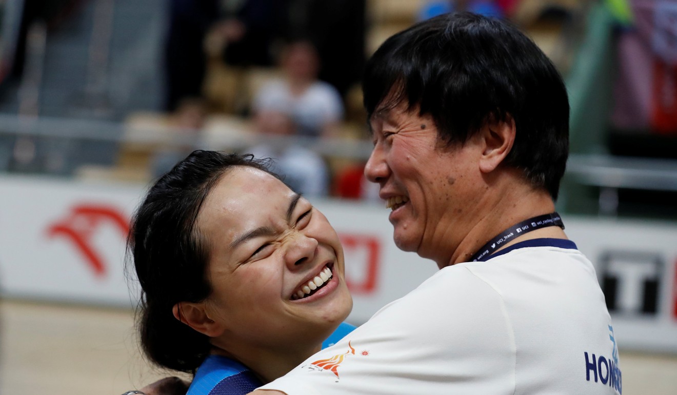 Sarah Lee hugs her coach, Shen Jinkang, after winning gold in the keirin in Pruszkow, Poland. Photo: Reuters