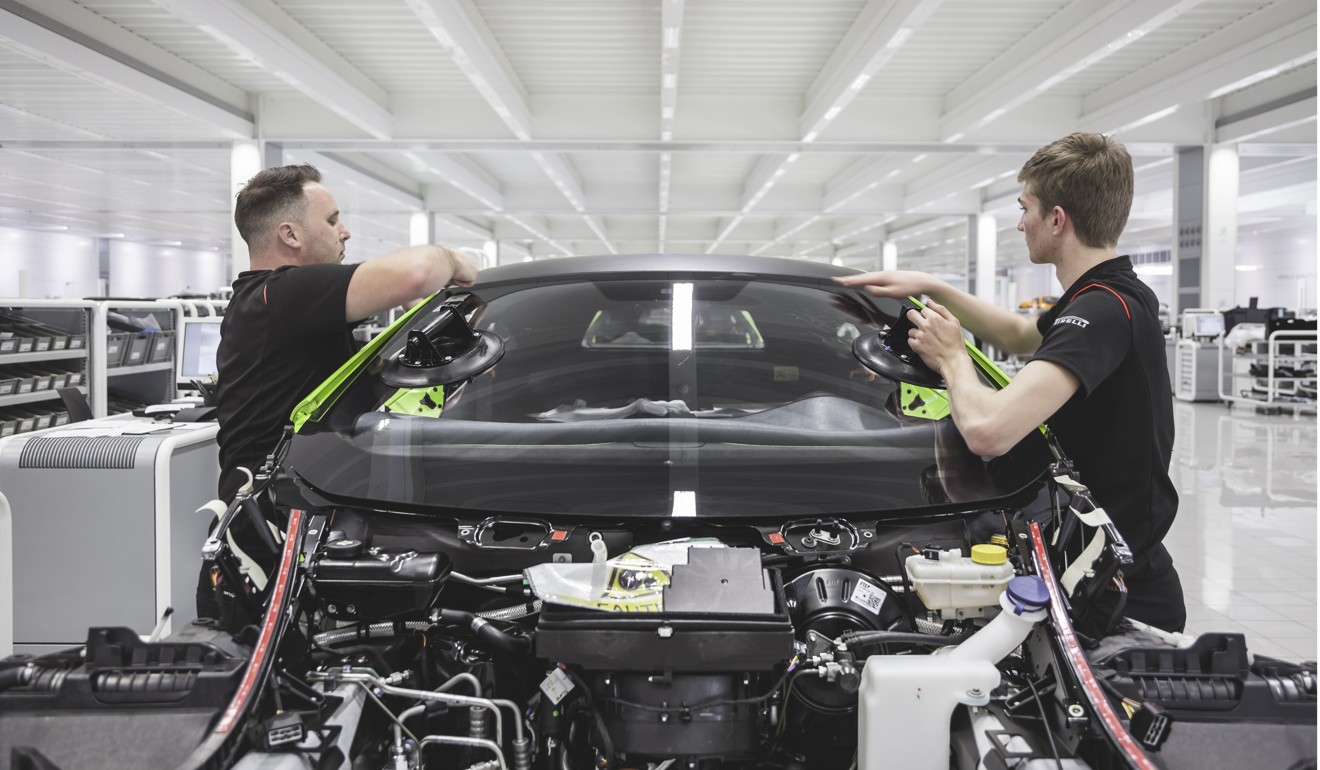 Engineers work on a McLaren car at the company’s production centre in Woking, UK. Photo: Handout