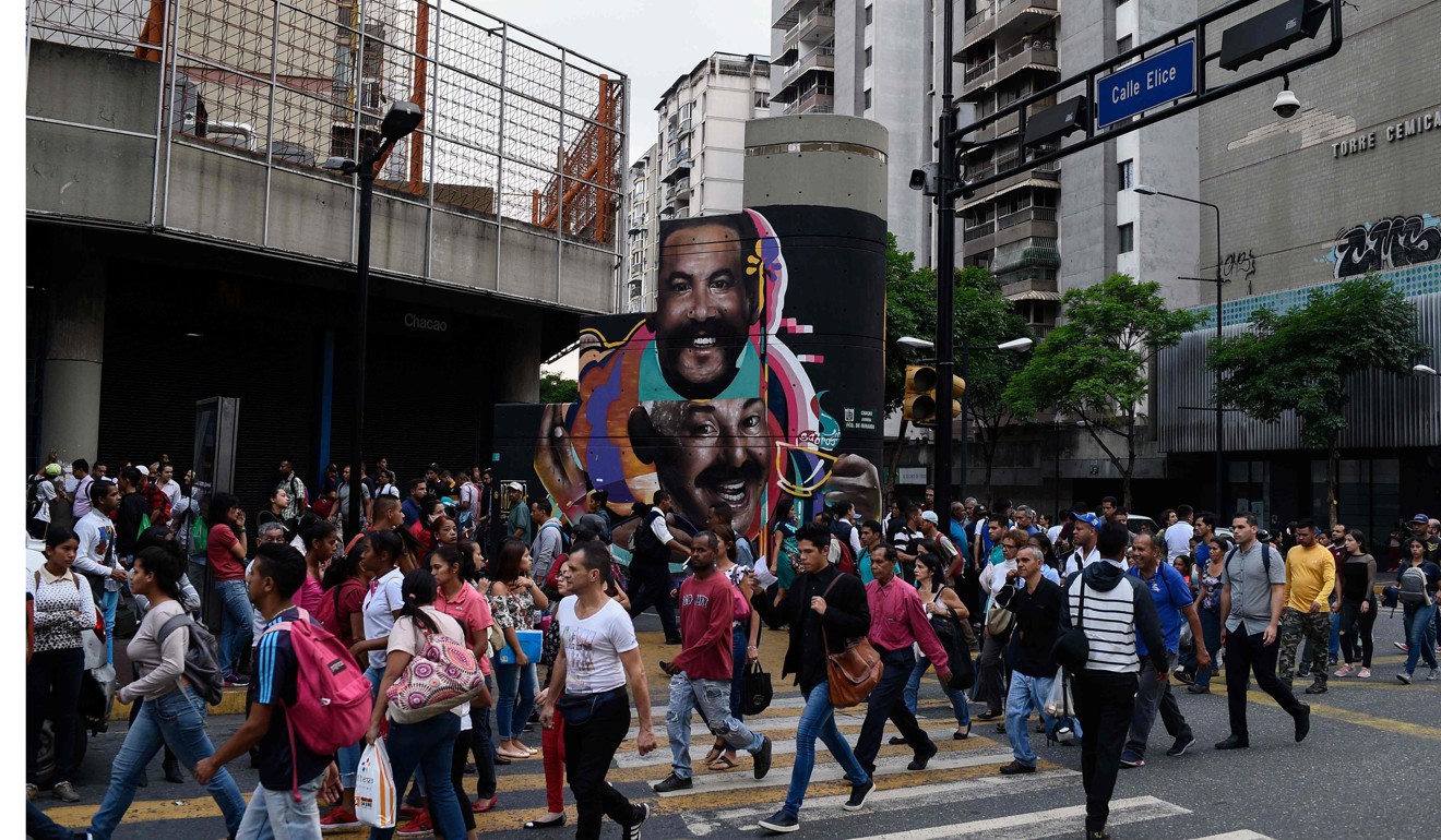 Commuters unable to use the subway due to a partial power cut, walk home. Photo: AFP