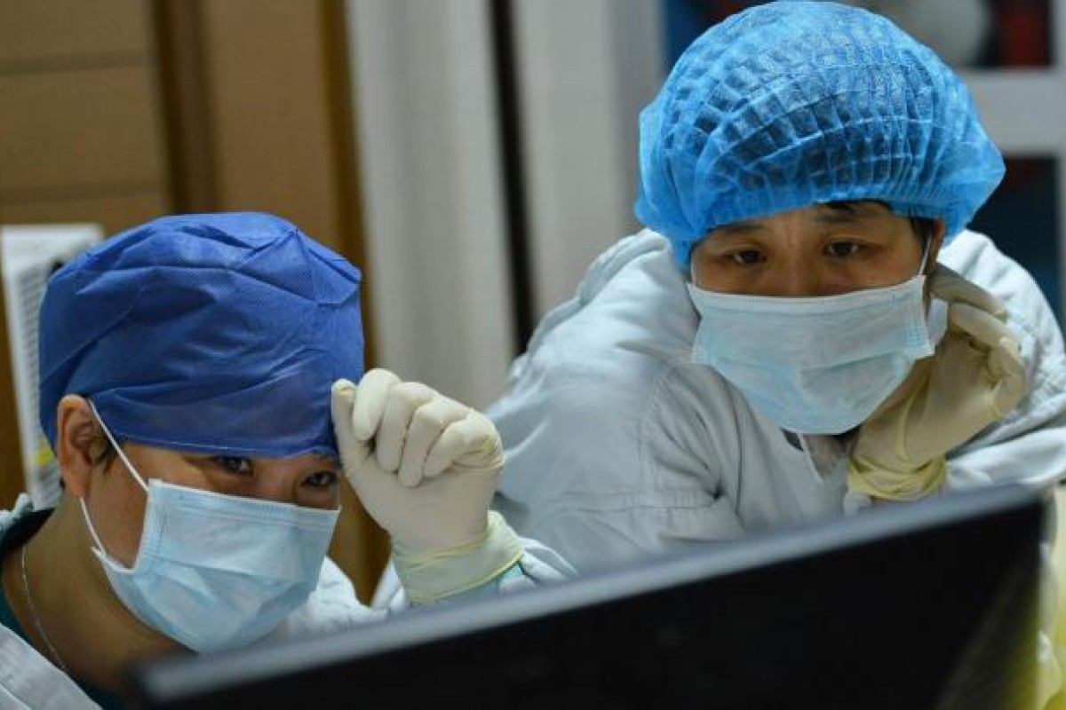 A patient, left, who was diagnosed with human H7N9 avian influenza ...