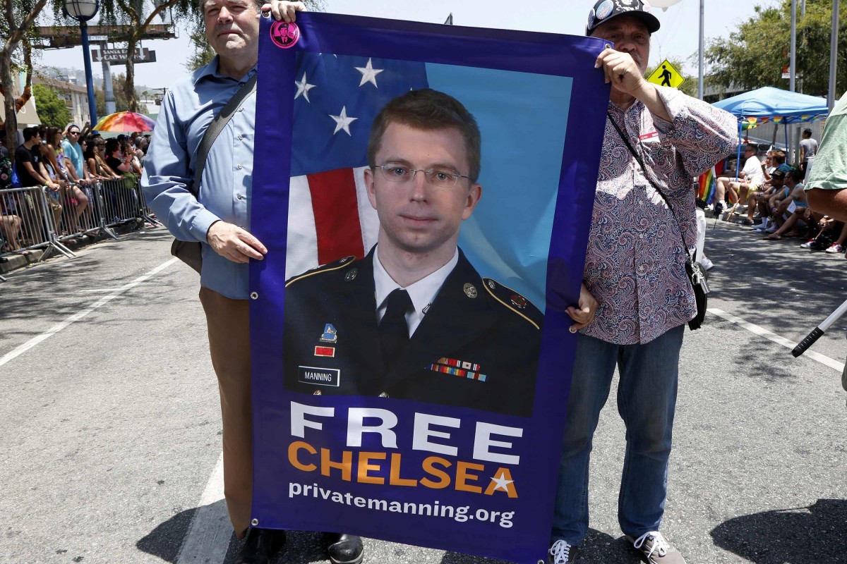 Men carry a free Chelsea Manning sign during the Los Angeles Pride parade in West Hollywood. Photo: Reuters