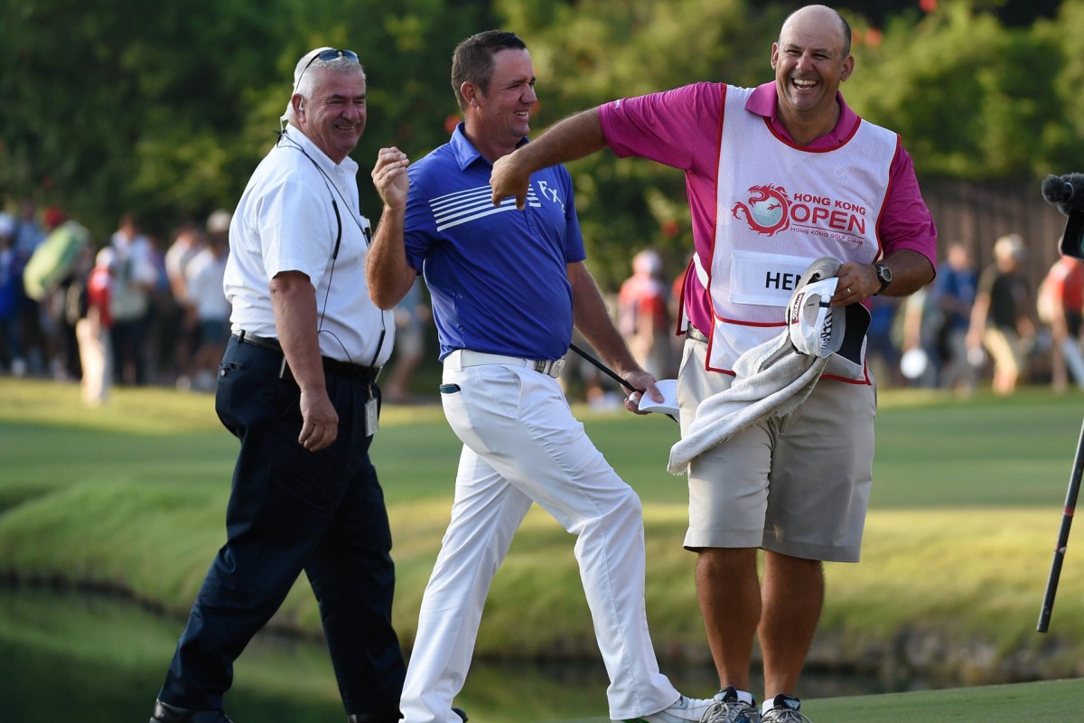 Scott Hend punches the air in delight as he wins the Hong Kong Open with a play-off victory over Filipino Angelo Que. Photos: Richard Castka