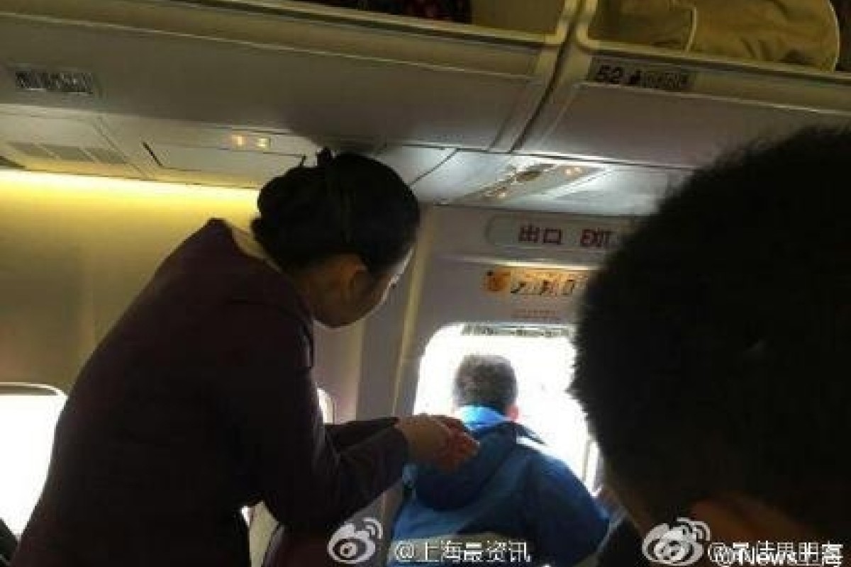 Chinese passenger opens emergency exit 'to get some fresh air' as plane prepares for take-off | South China Morning Post Chinese passenger opens emergency exit 'to get some fresh air' as plane prepares for take-off | South China Morning Post