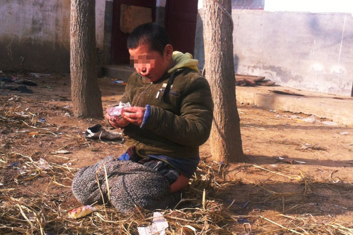 Chinese homeless shelter ties mentally ill boy to tree to 'stop him