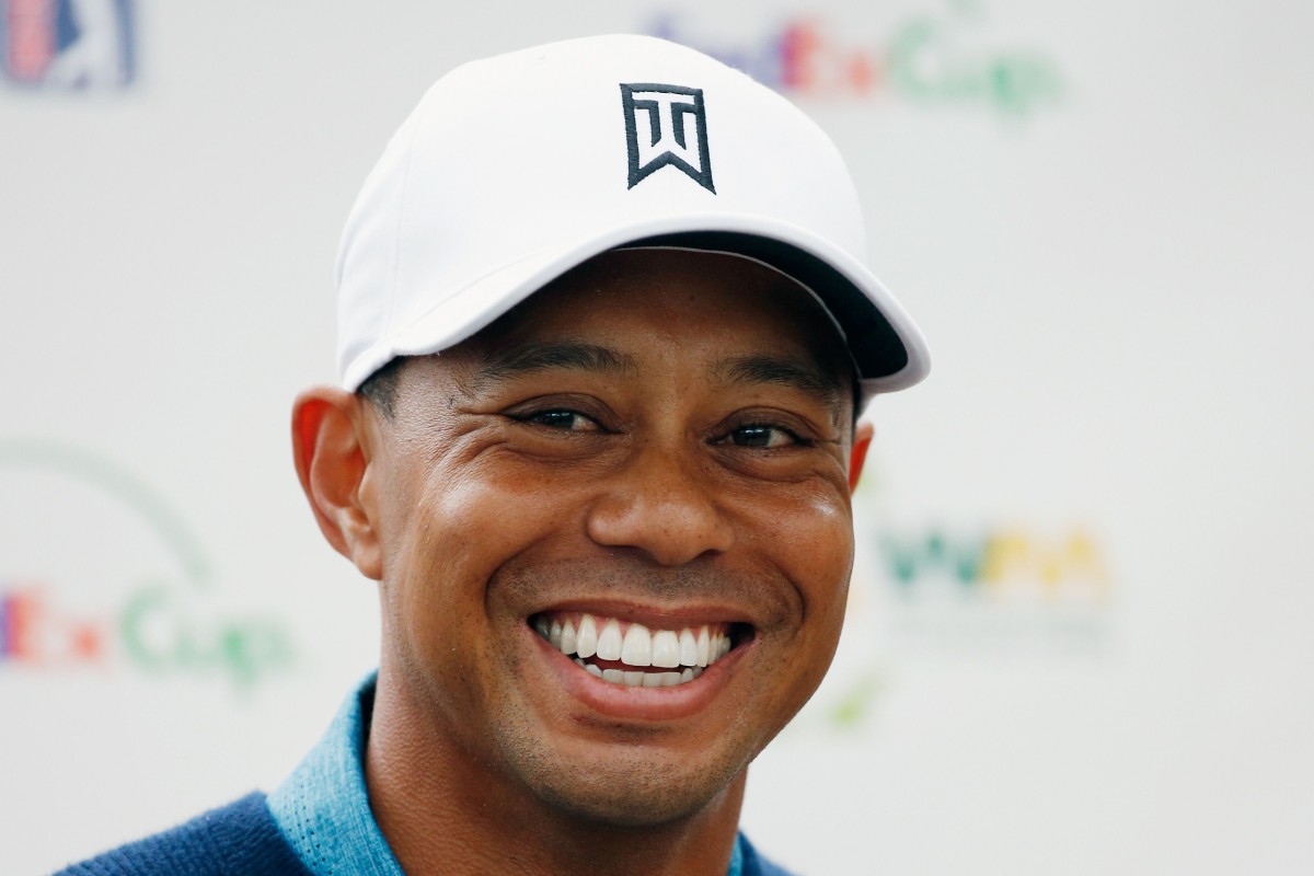 Nothing but the tooth Tiger Woods all smiles as he defies dental