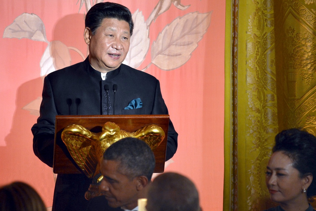Chinese President Xi Jinping speaks as his wife Madame Peng Liyuan and US President Barack Obama listen during a state dinner at the White House in Washington on Friday. Photo: Reuters