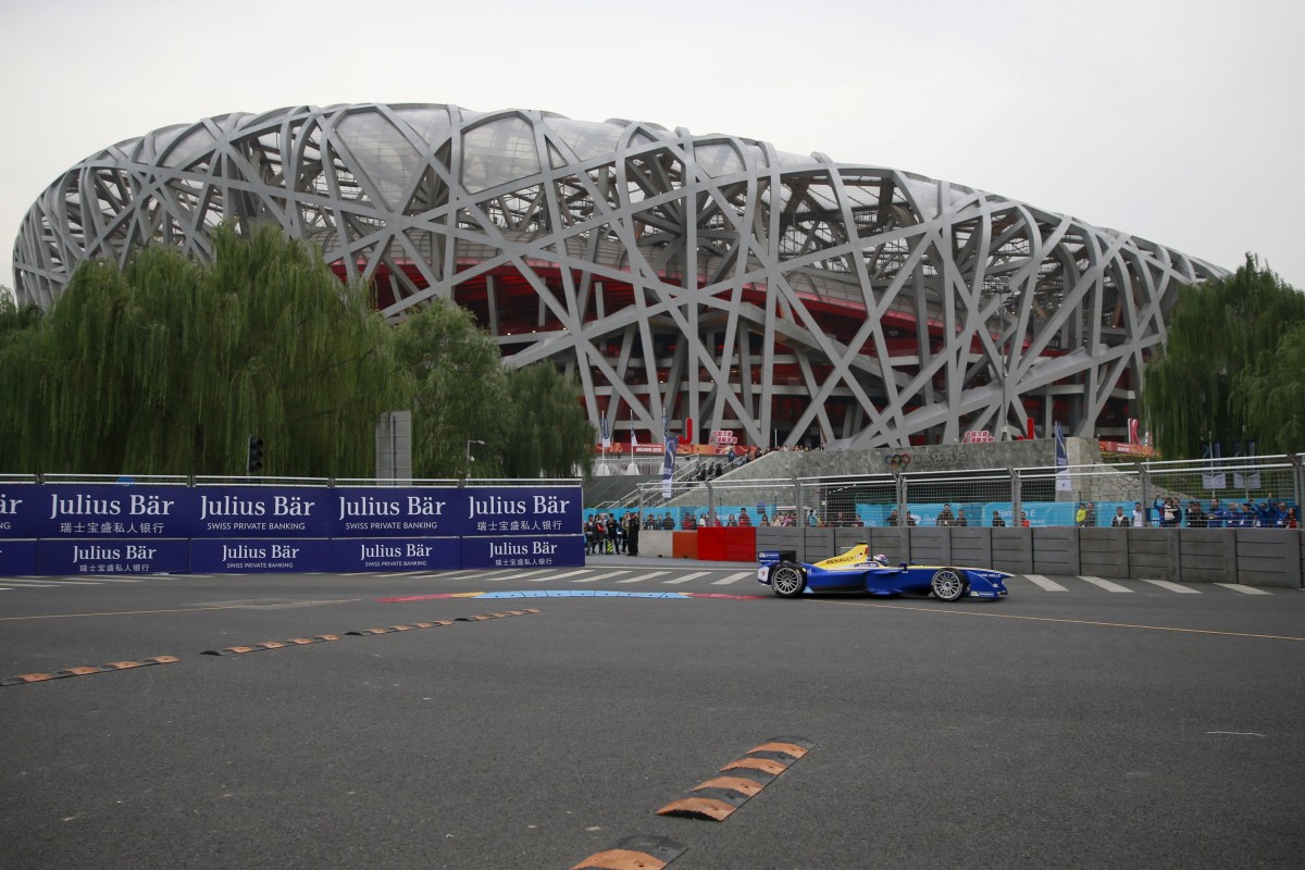Sebastien Buemi races past the Bird's Nest Stadium in Beijing. Photo: Reuters