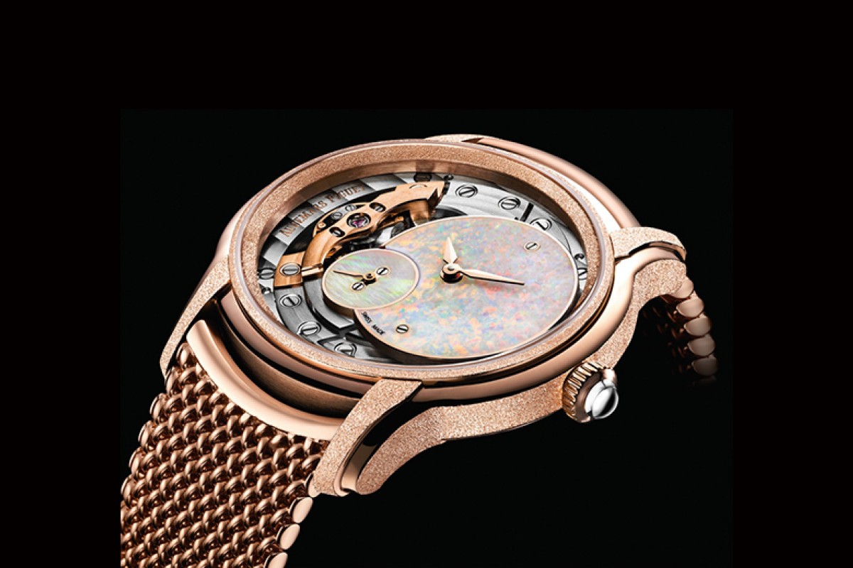 Millenary Frosted Gold Opal Dial watch in 18-carat pink gold, hammered and satin-finished, with white opal dials. Complemented with an 18-carat pink gold Polish mesh bracelet.