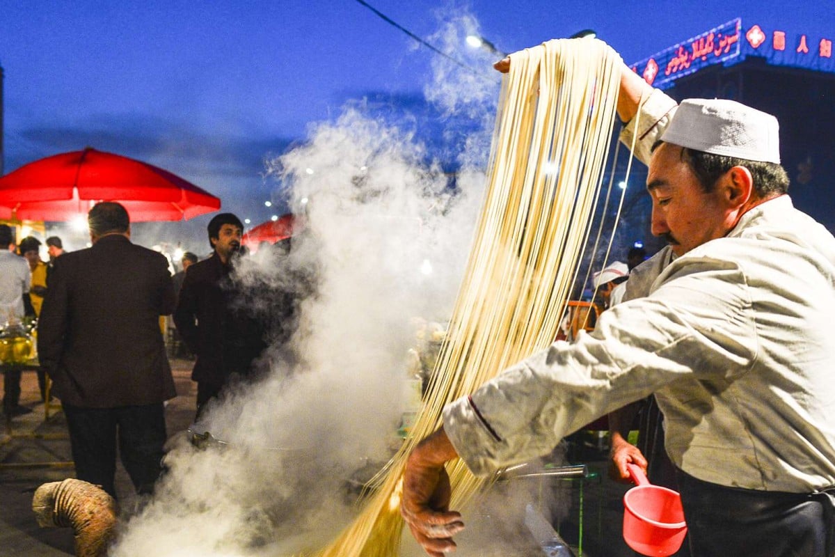 A file picture of a Uygur stall holder making noodles in Bachu county in Xinjiang. Hundreds of people have died in attacks blamed by the authorities on Islamist militants in the region over the past two years. Photo: Xinhua