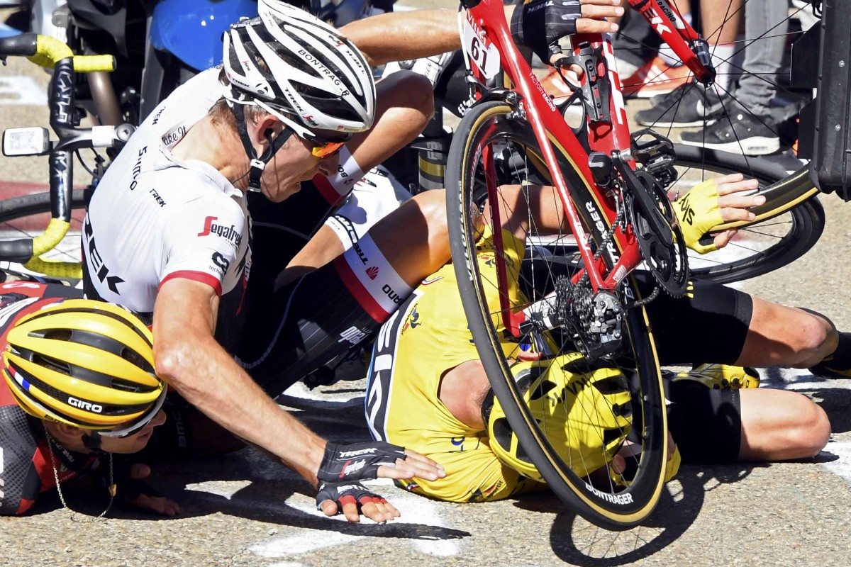 Chris Froome hits the ground in his yellow jersey. Photo: Reuters