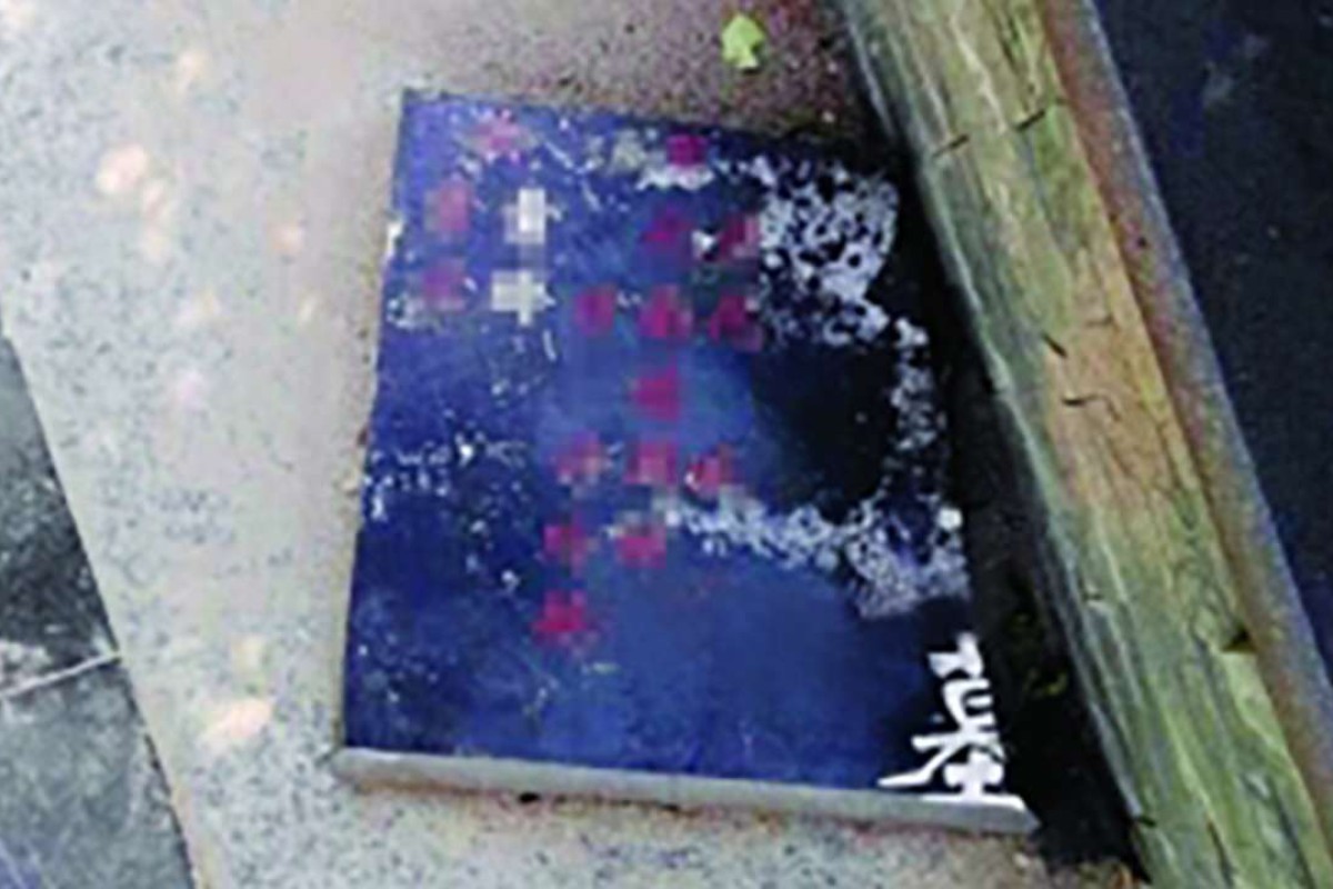Marble gravestones used to build Chinese city’s residential flower bed