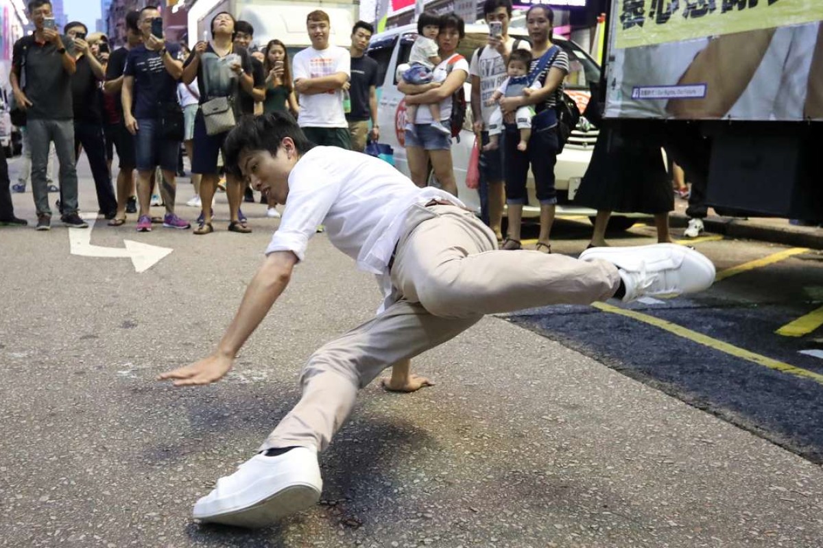 Mover and shaker Hong Kong election winner entertains shoppers with a