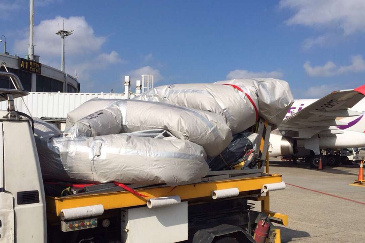 TransAsia flight delayed in Taiwan after emergency slide accidentally triggered South China